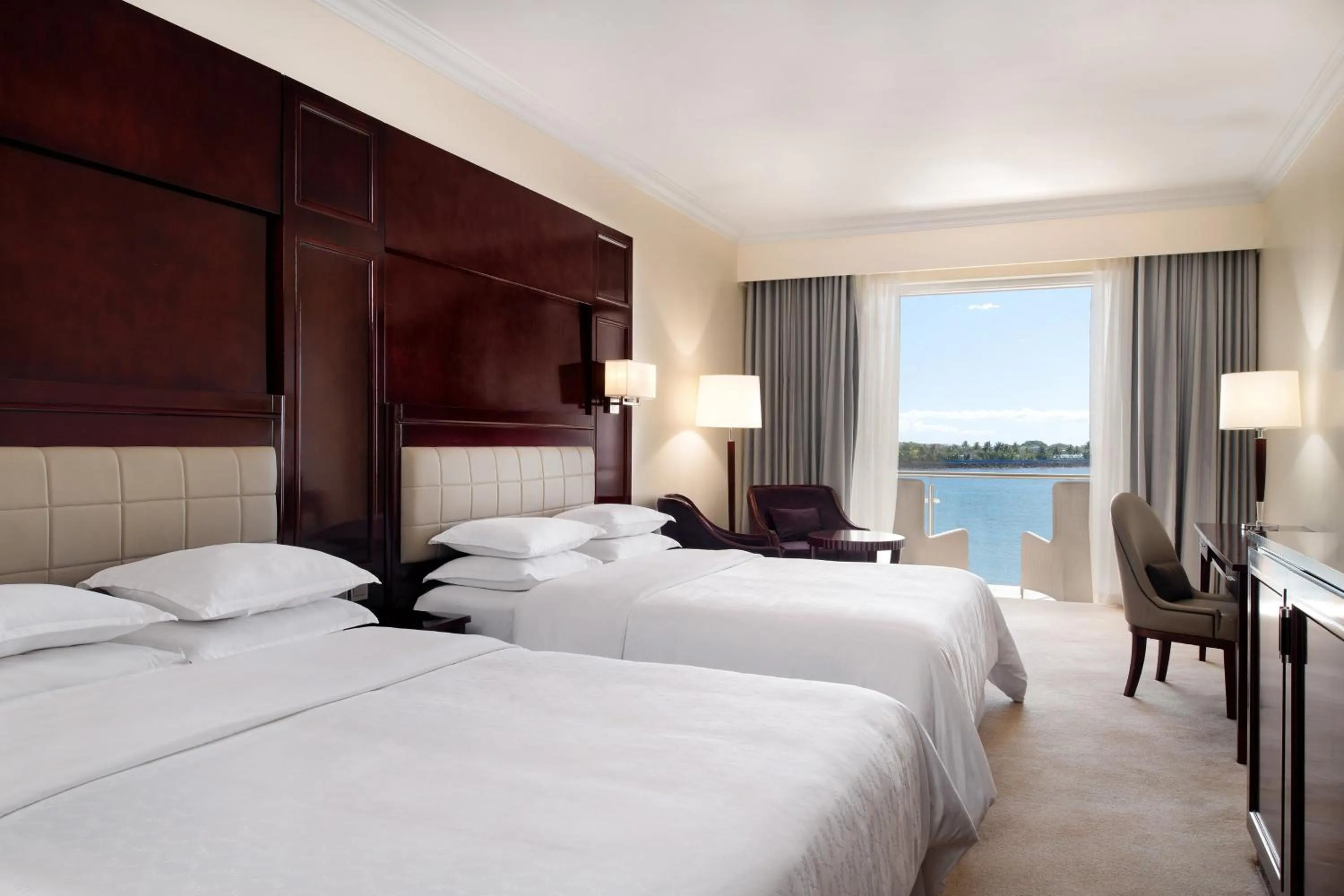 Photo of the whole room, Bed in Sheraton Samoa Aggie Grey's Hotel & Bungalows