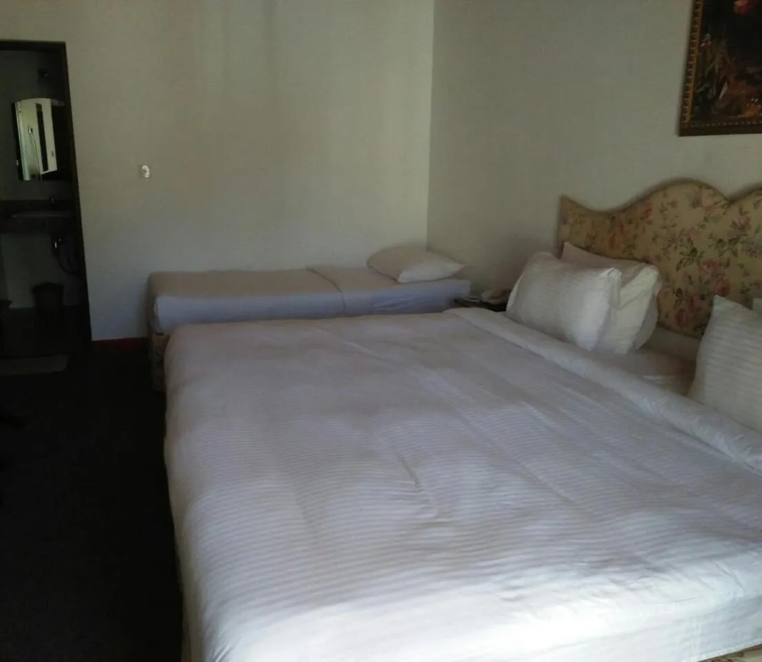 Bed in Tea Bush Hotel