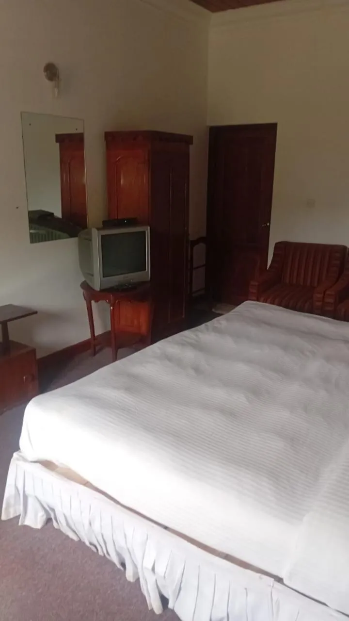 Bed in Tea Bush Hotel