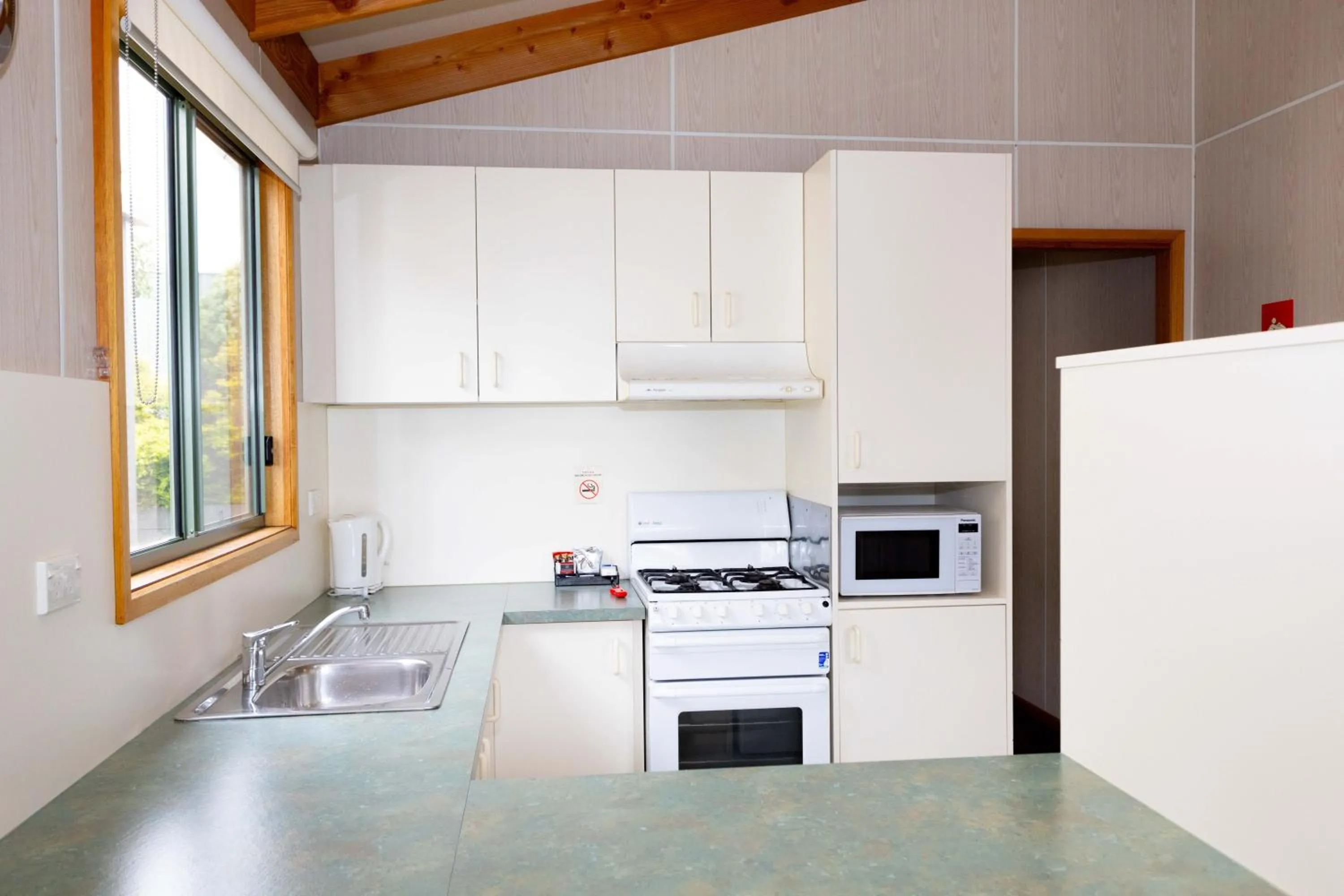 kitchen in Airport Tourist Village Melbourne