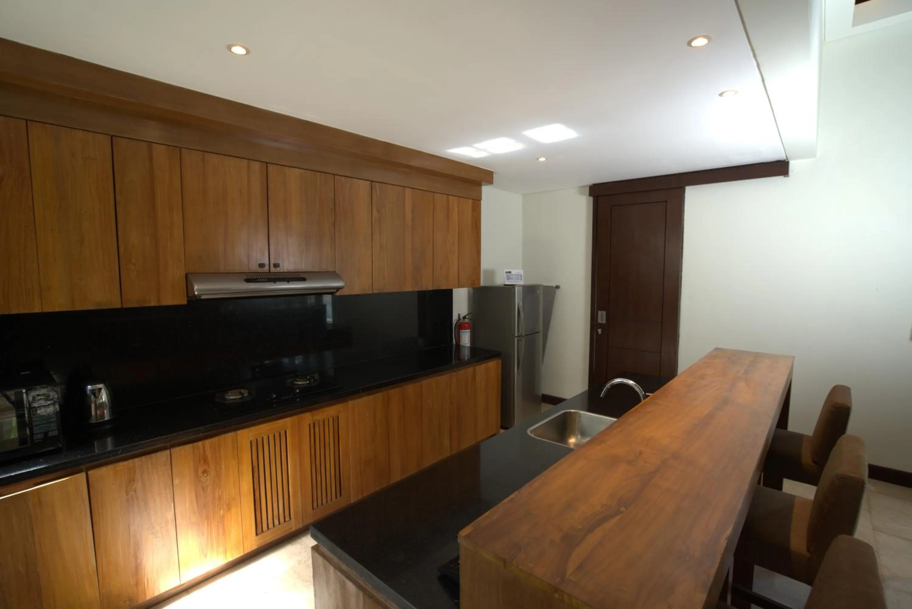 Kitchen or kitchenette in Mahagiri Villas & Spa Dreamland