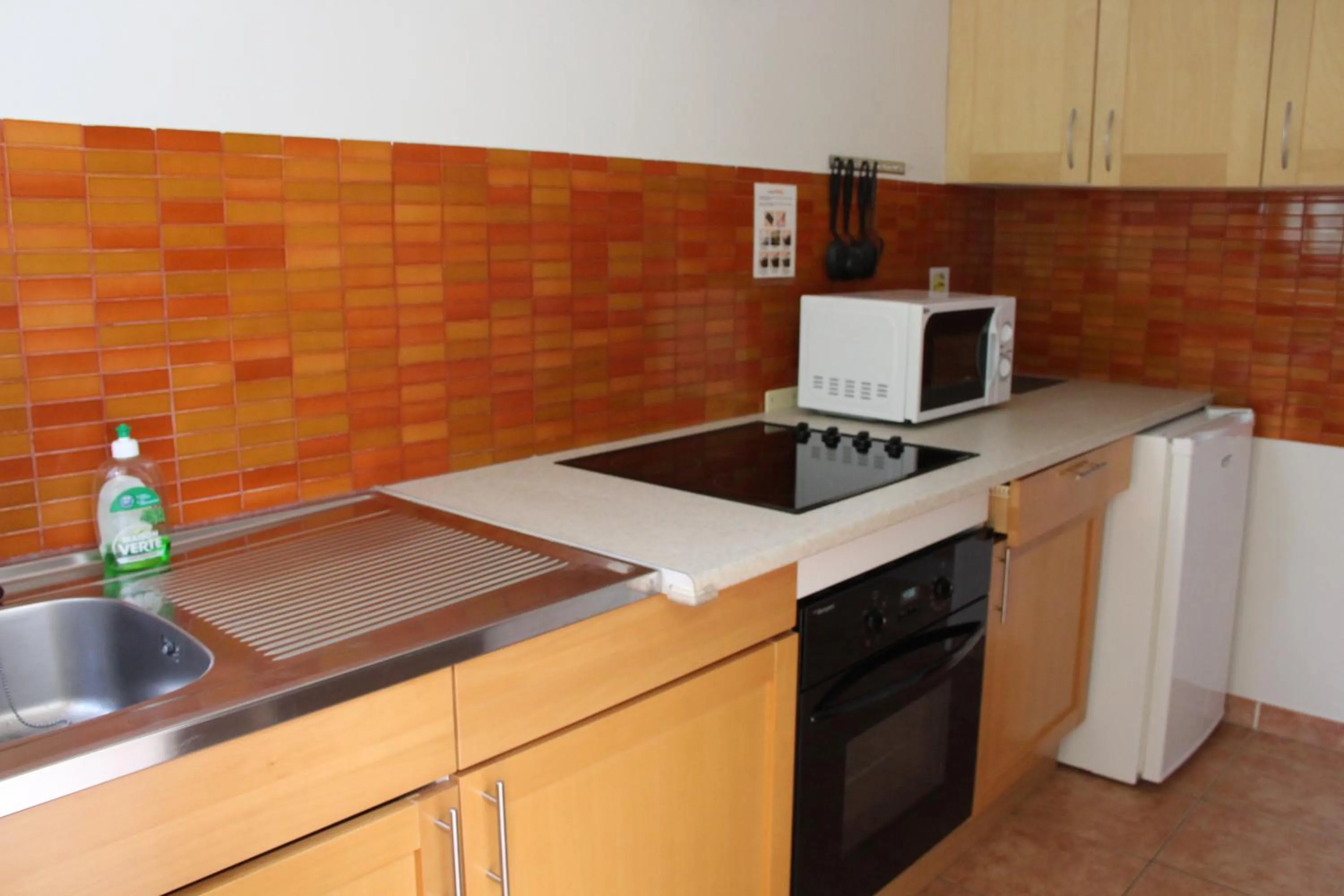 Kitchen or kitchenette in Résidence les Caraibes