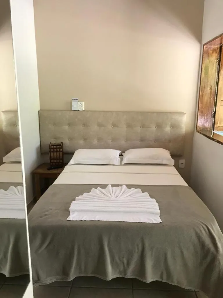 Bed in Pousada Tropical
