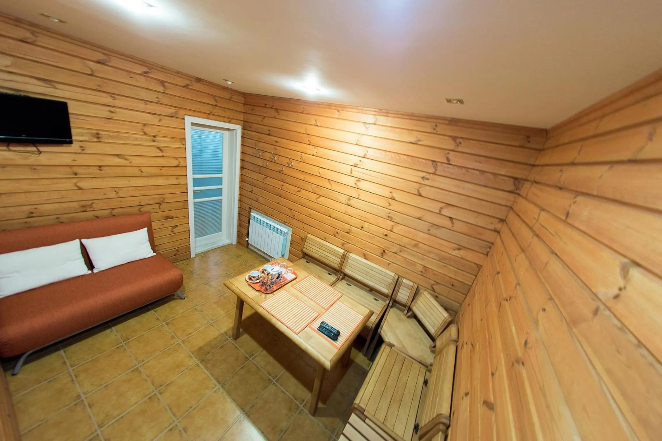 Communal lounge/ TV room in ABC Apartments Business Class