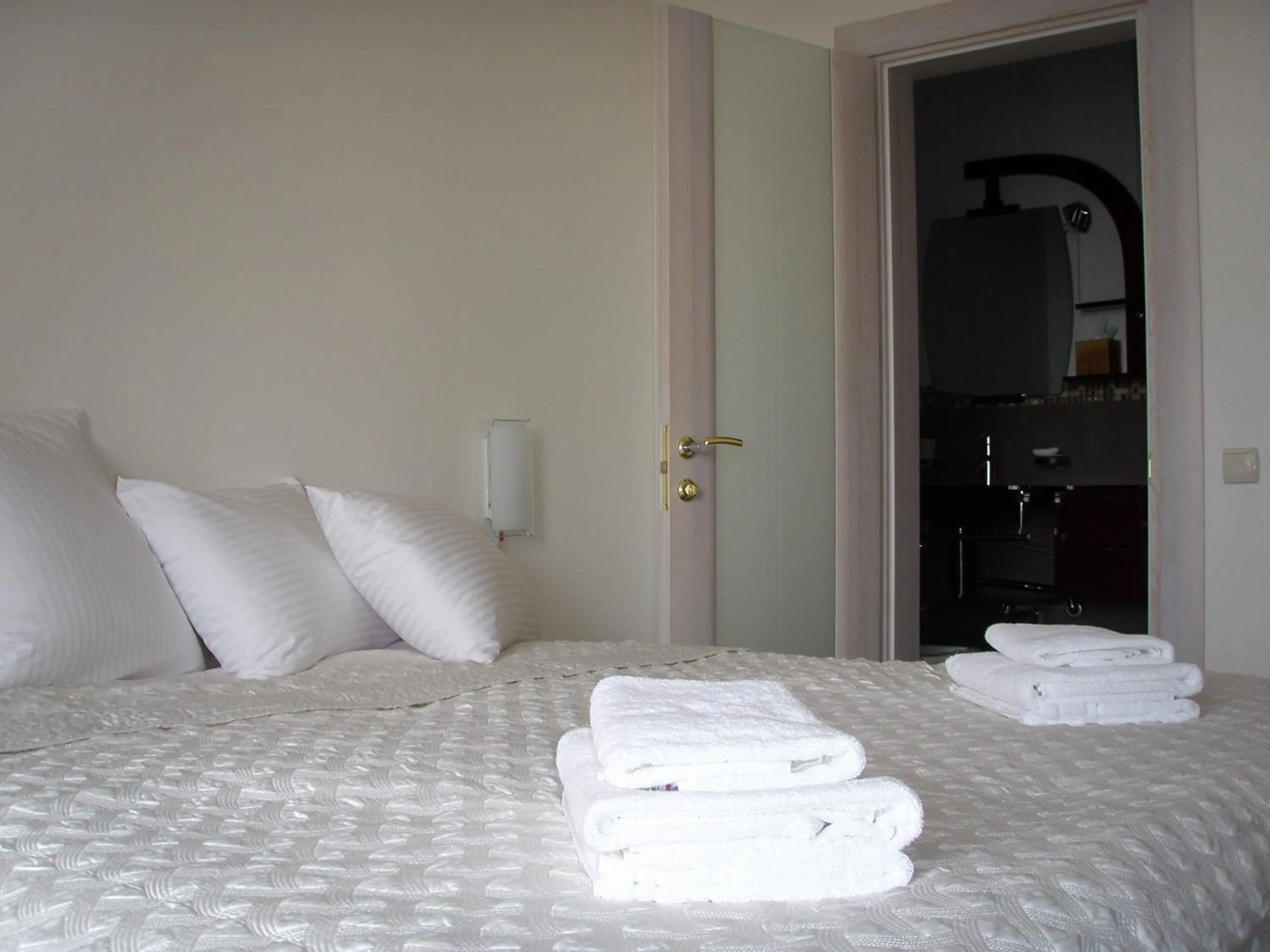 Bed in ABC Apartments Business Class