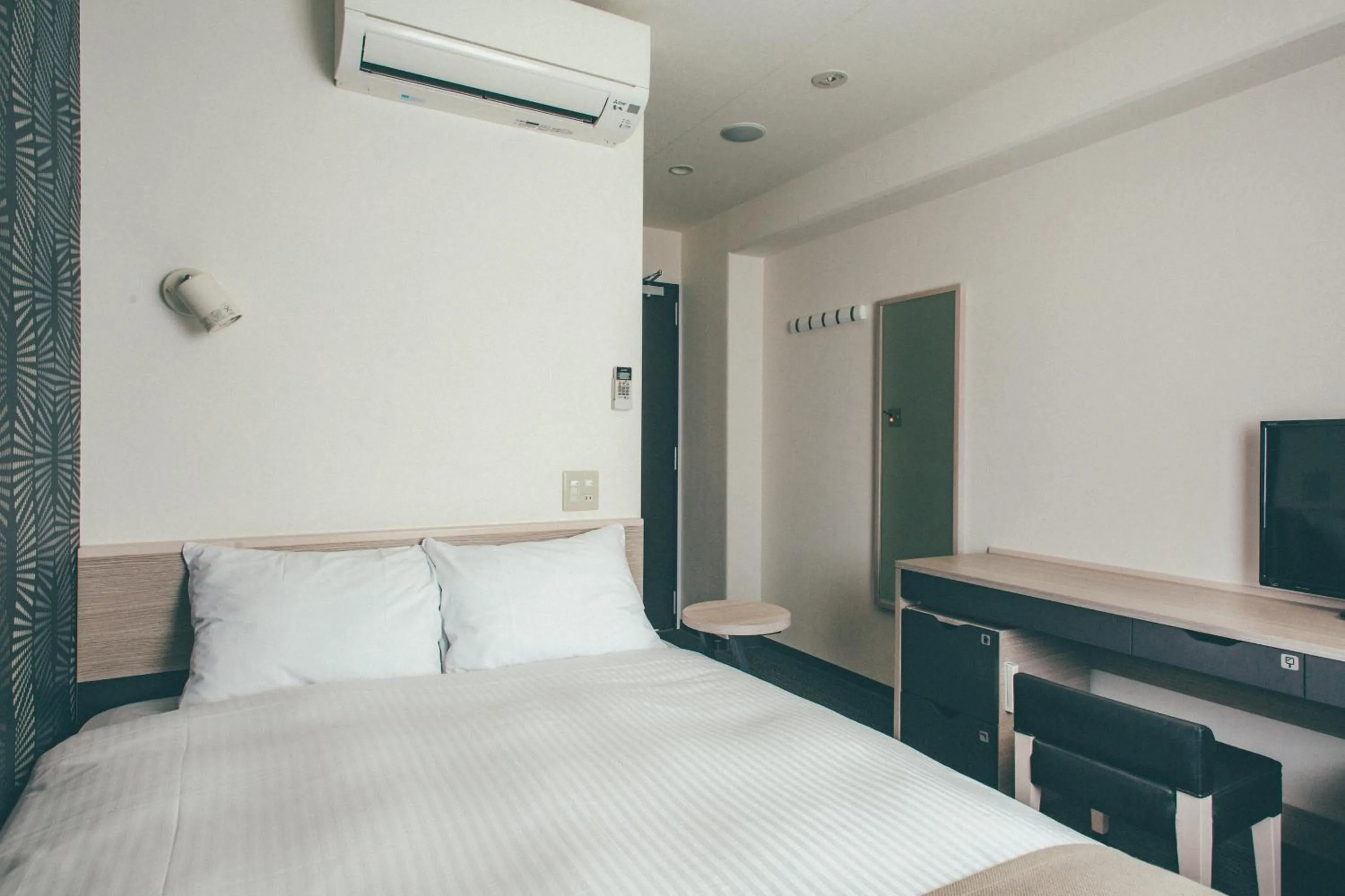 Bed in Kuretake Inn Nankai Sakai-Ekimae