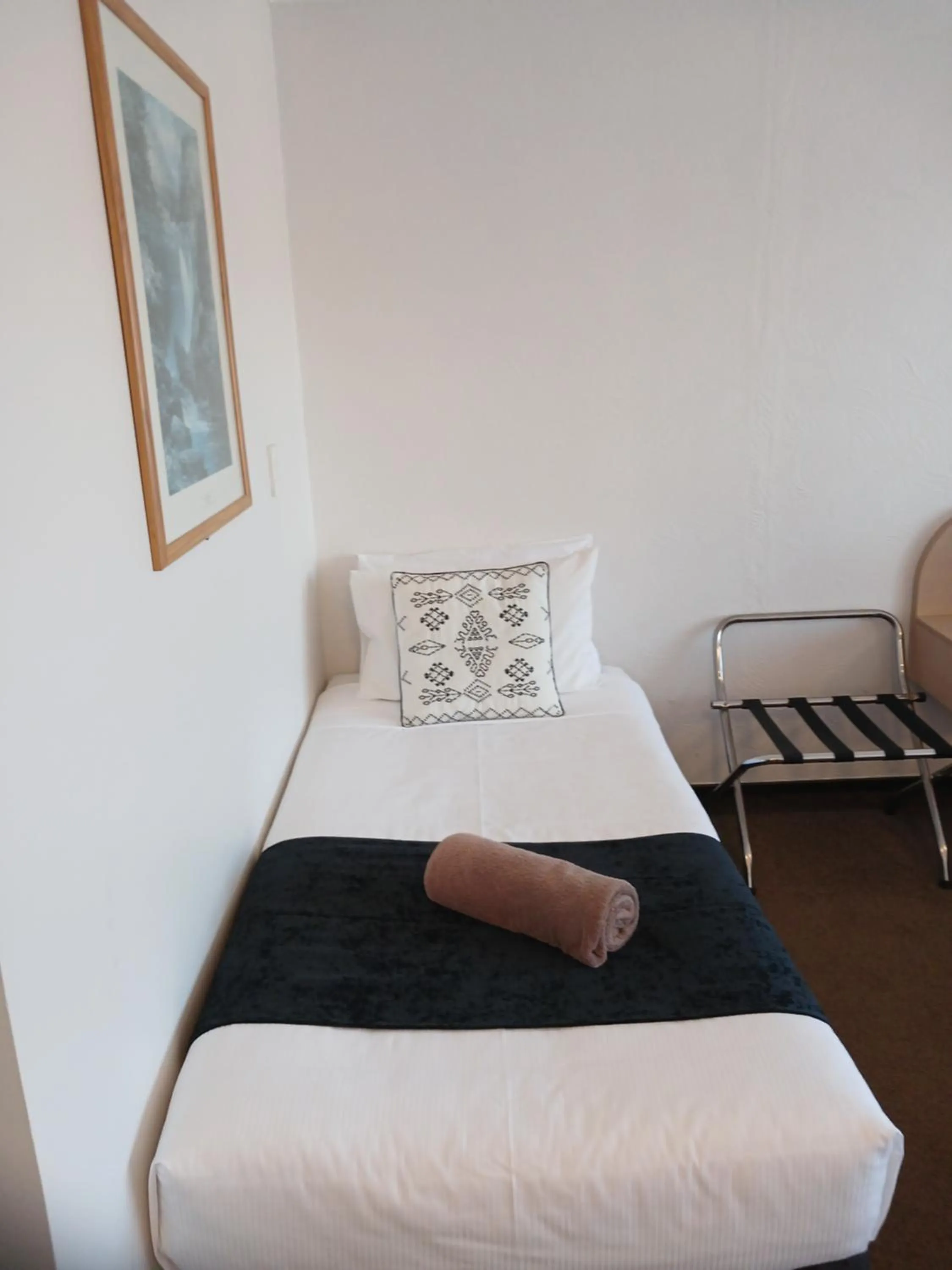 Bed in Palm City Motor Inn