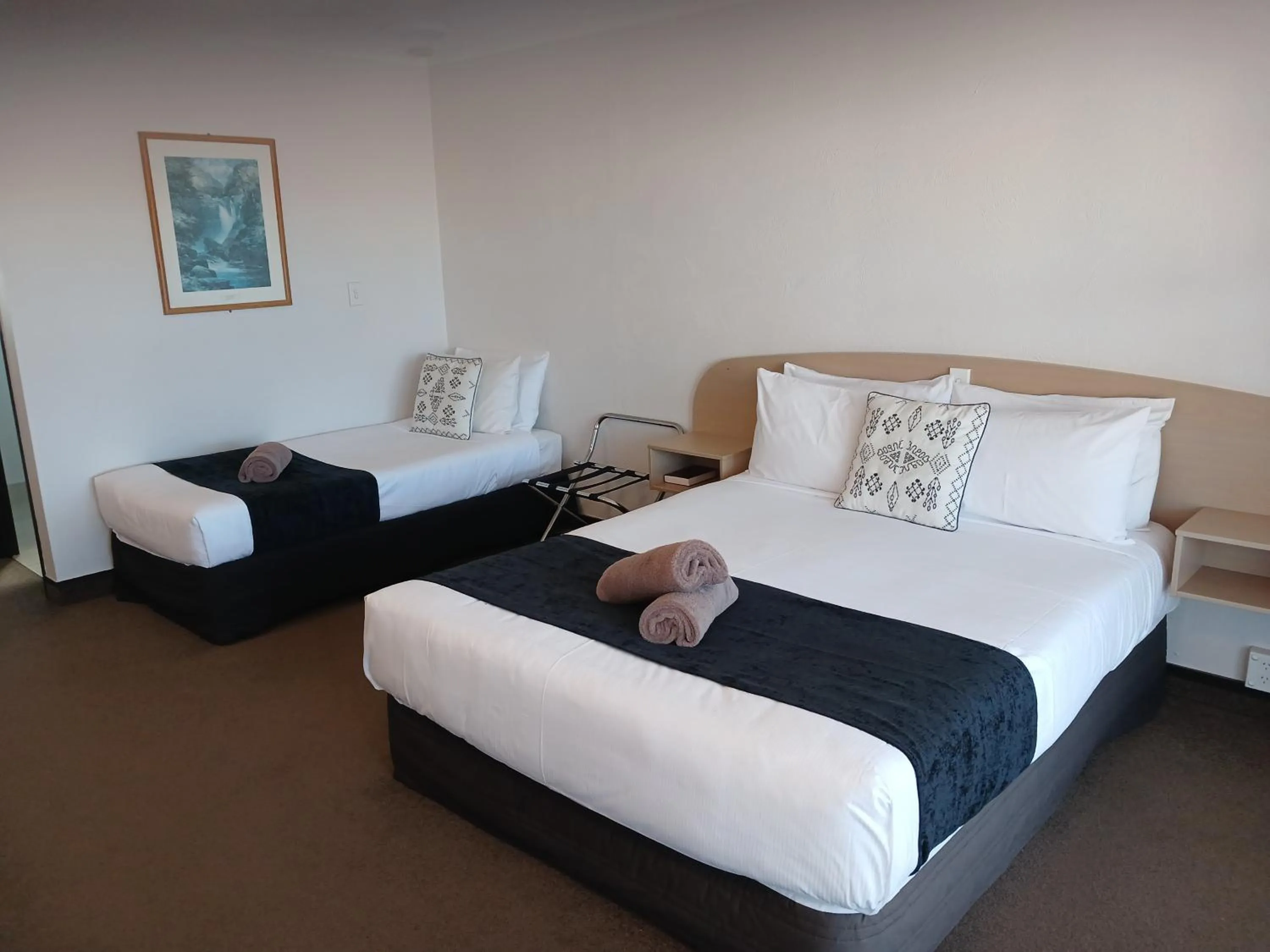 Bed in Palm City Motor Inn