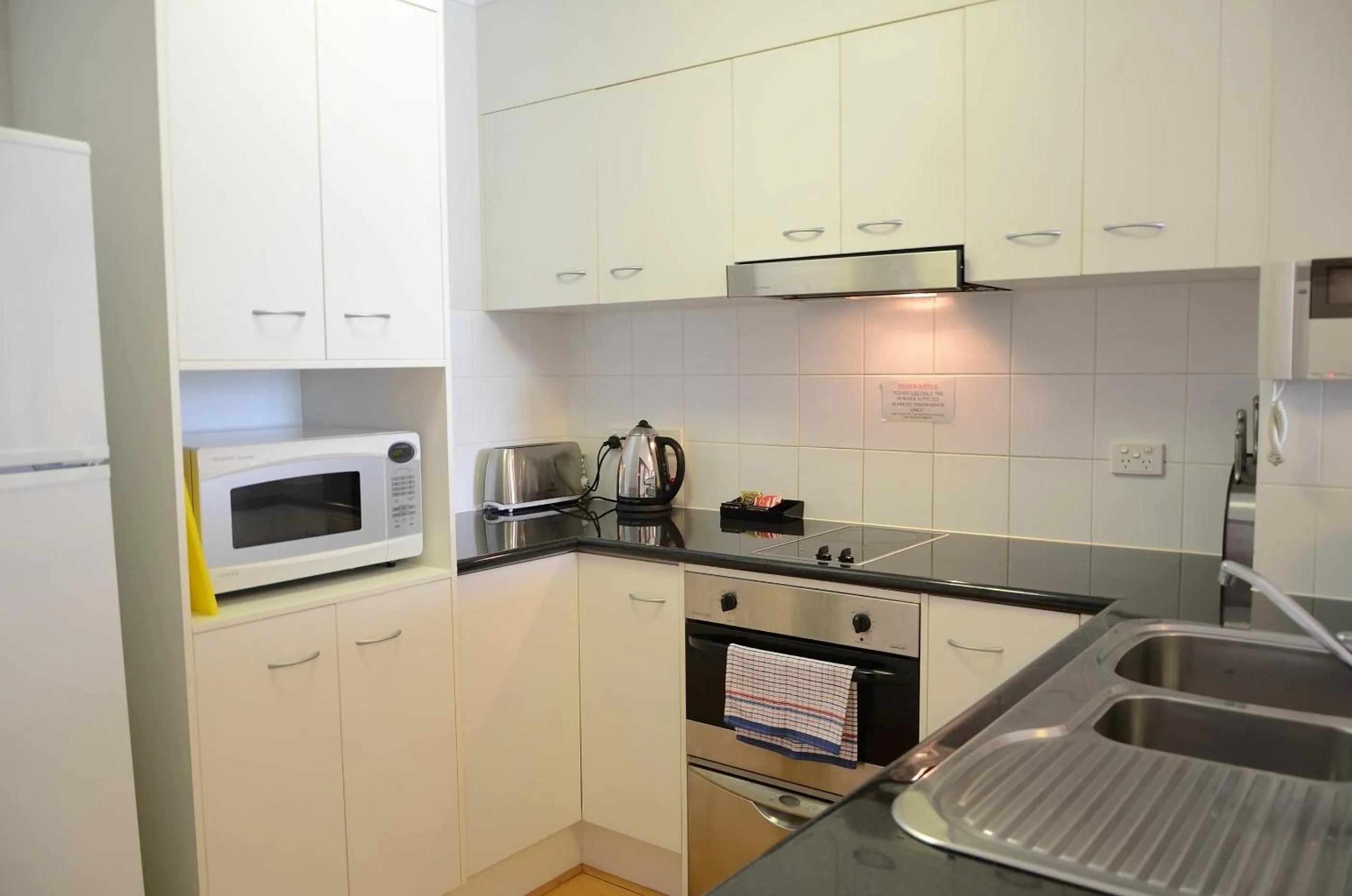 Kitchen or kitchenette in Frisco Apartments