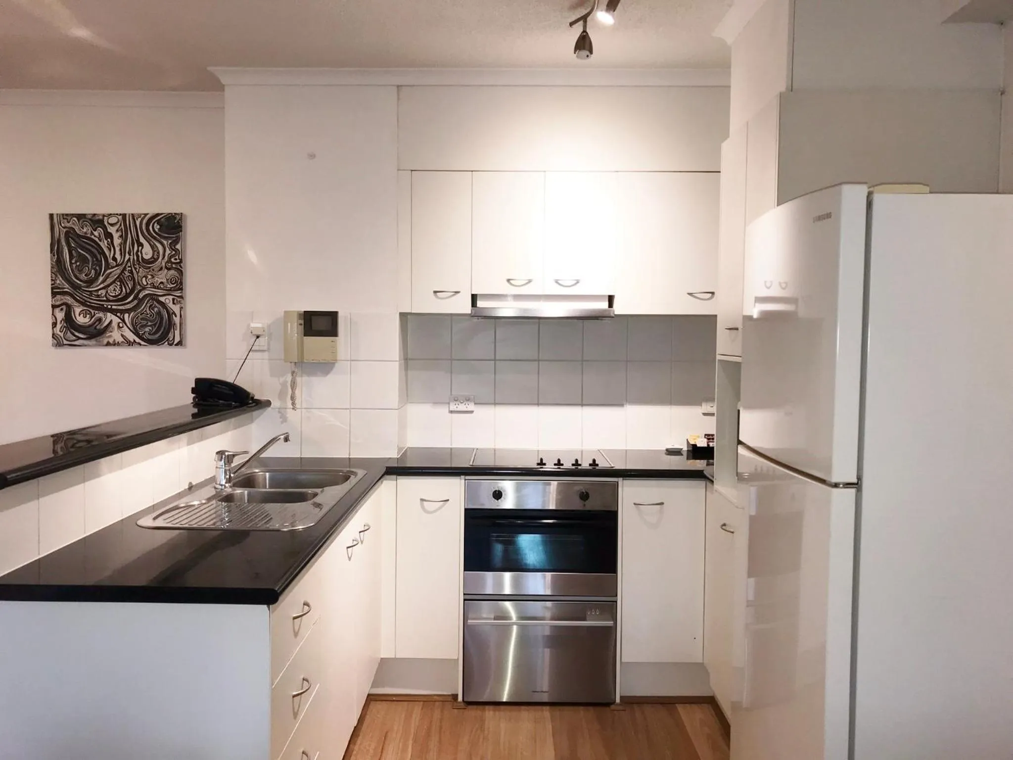 Kitchen or kitchenette in Frisco Apartments