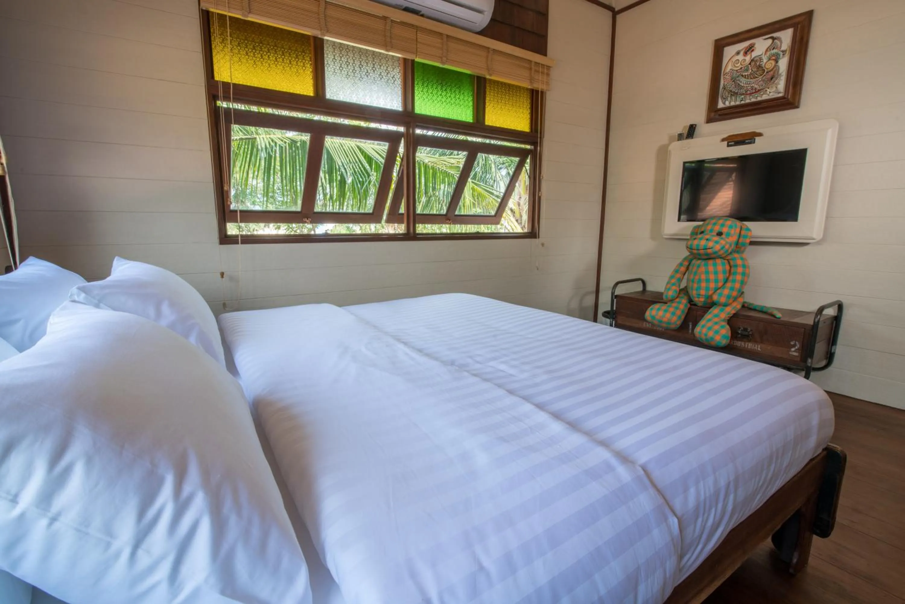 Bed in Suankaew Art Cottage