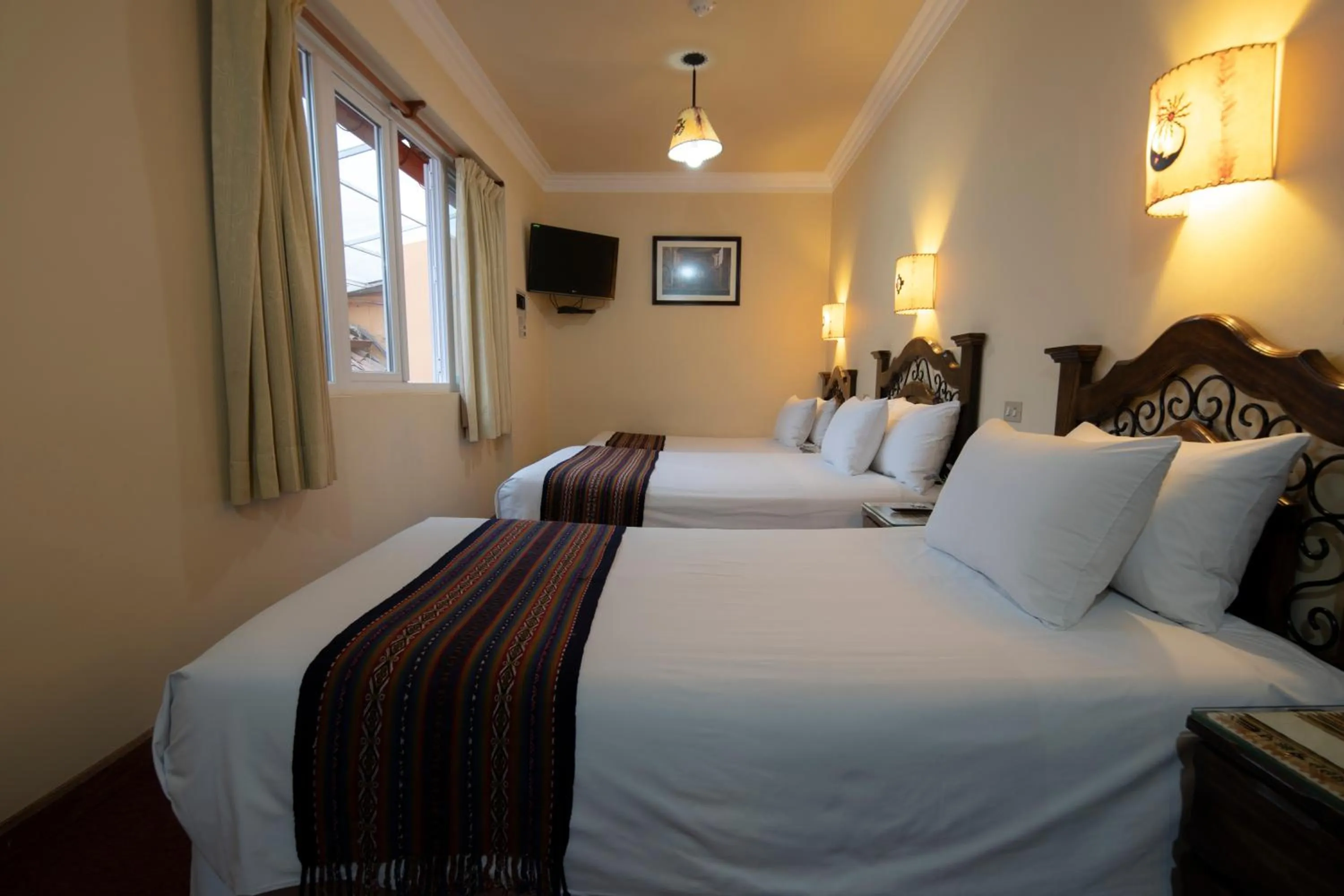 Bed in Hotel Rojas Inn