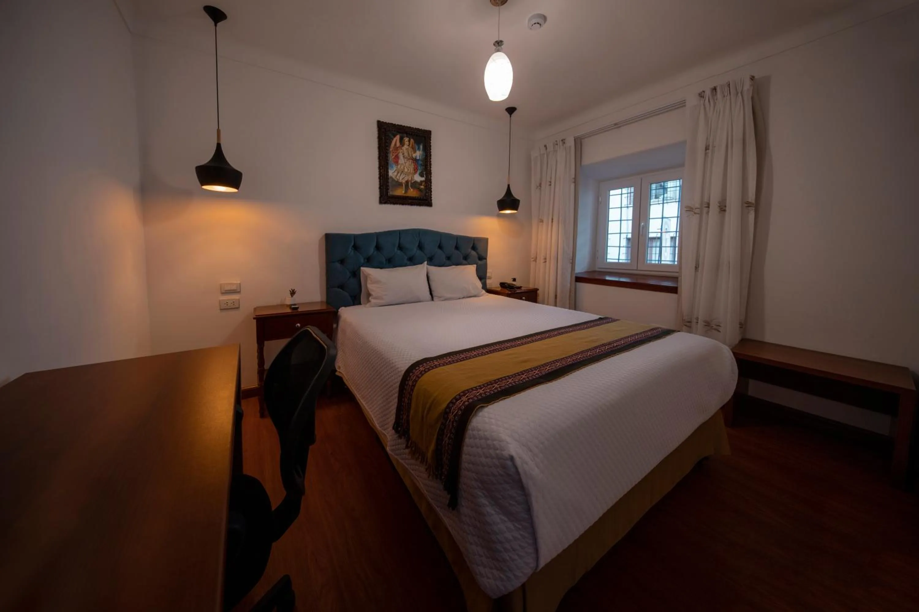 Bed in Hotel Rojas Inn