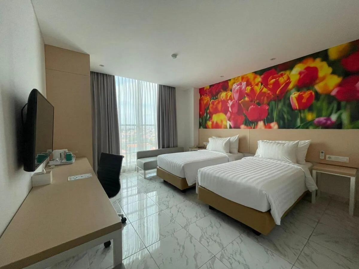 Bed in PALM PARK Hotel Surabaya