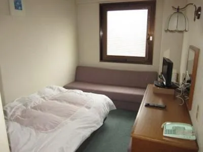 Bed in Aoi Business Hotel