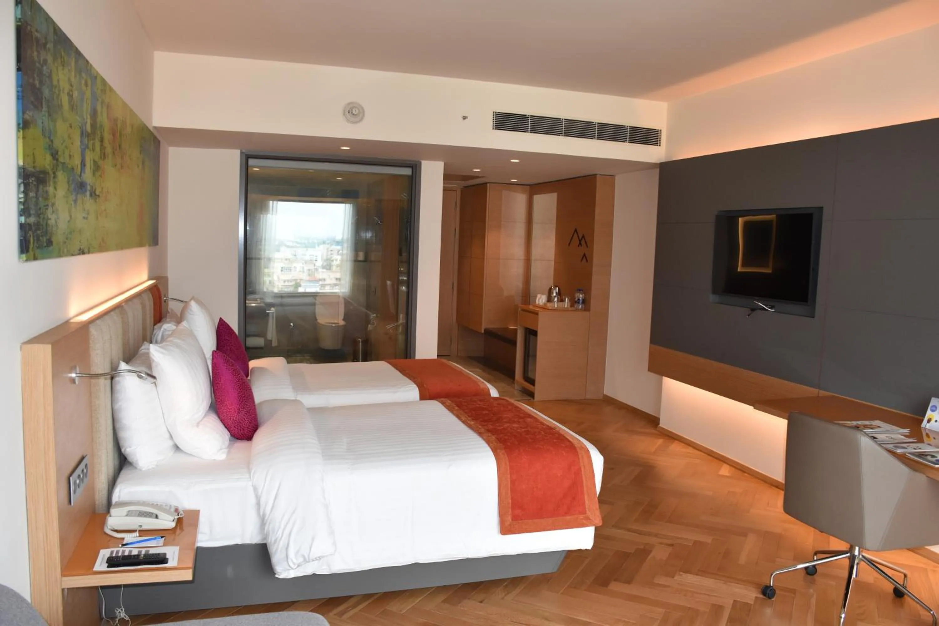 Photo of the whole room, Bed in Novotel Vijayawada Varun