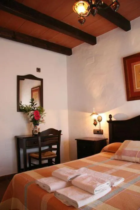Photo of the whole room, Bed in Hostal Torre de Guzmán