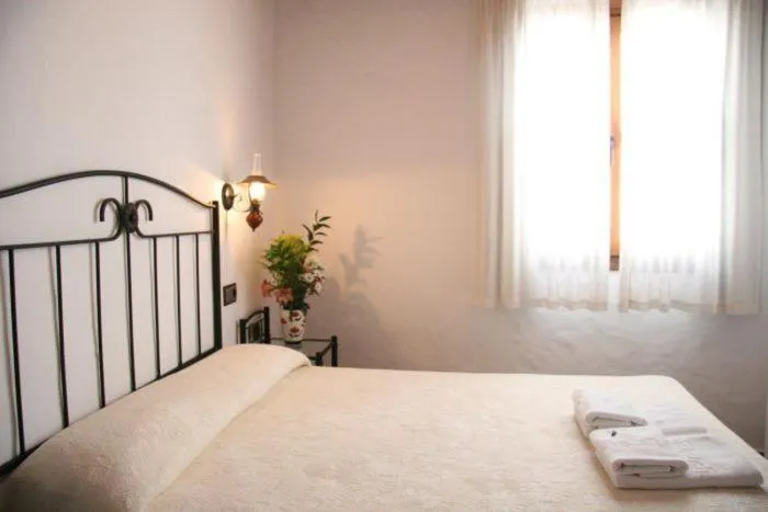 Bed in Hostal Torre de Guzmán