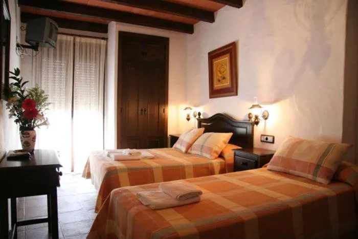 Photo of the whole room, Bed in Hostal Torre de Guzmán