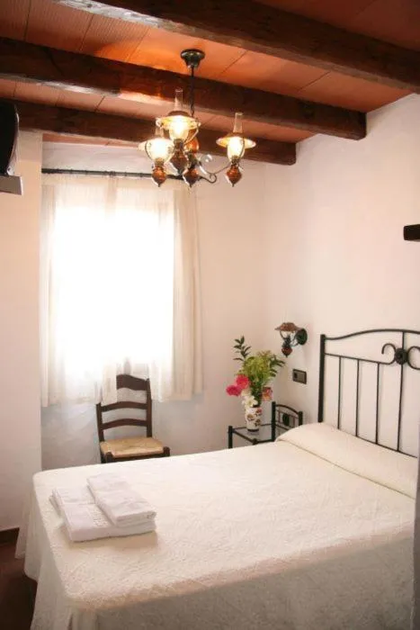 Photo of the whole room, Bed in Hostal Torre de Guzmán