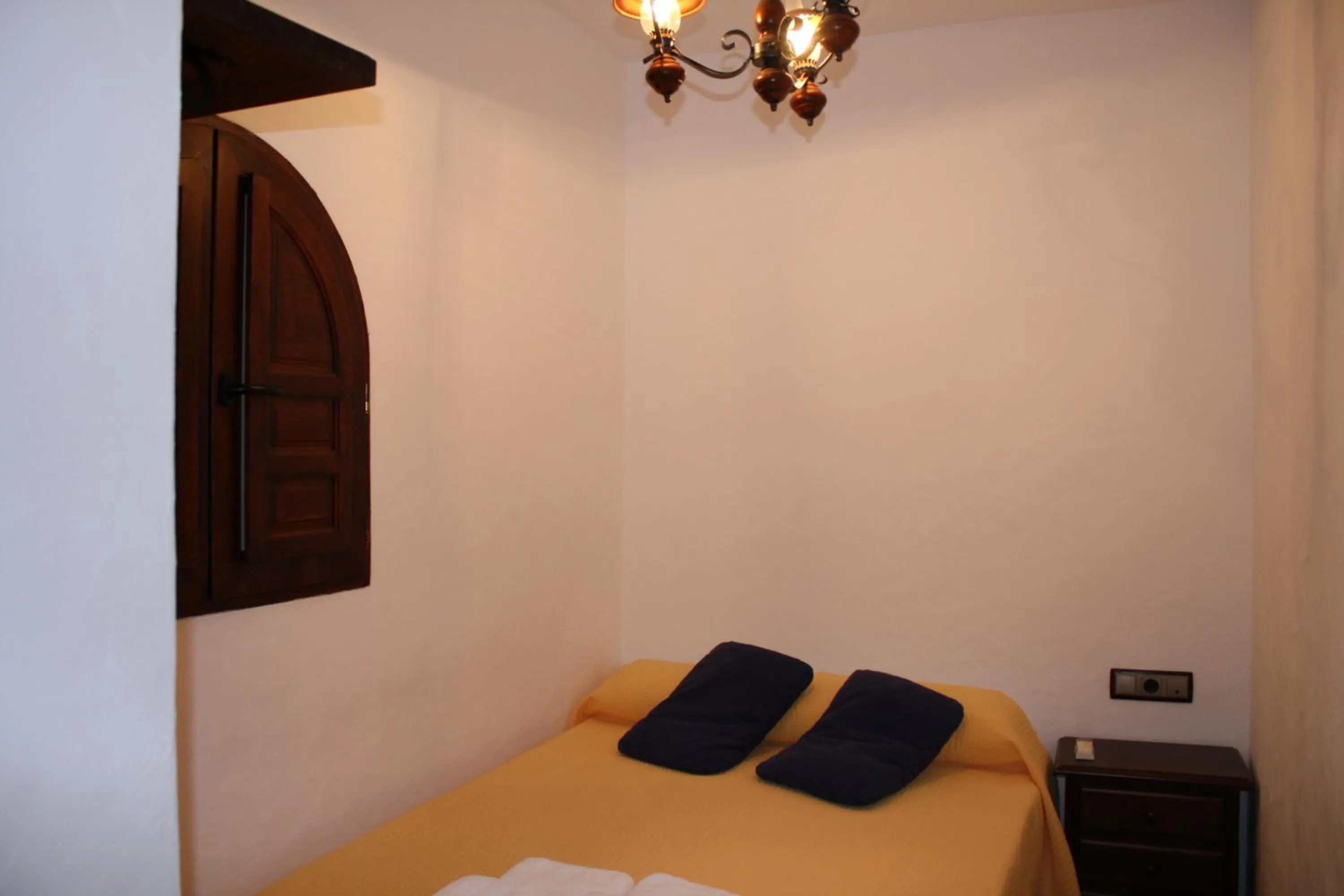 Photo of the whole room, Bed in Hostal Torre de Guzmán