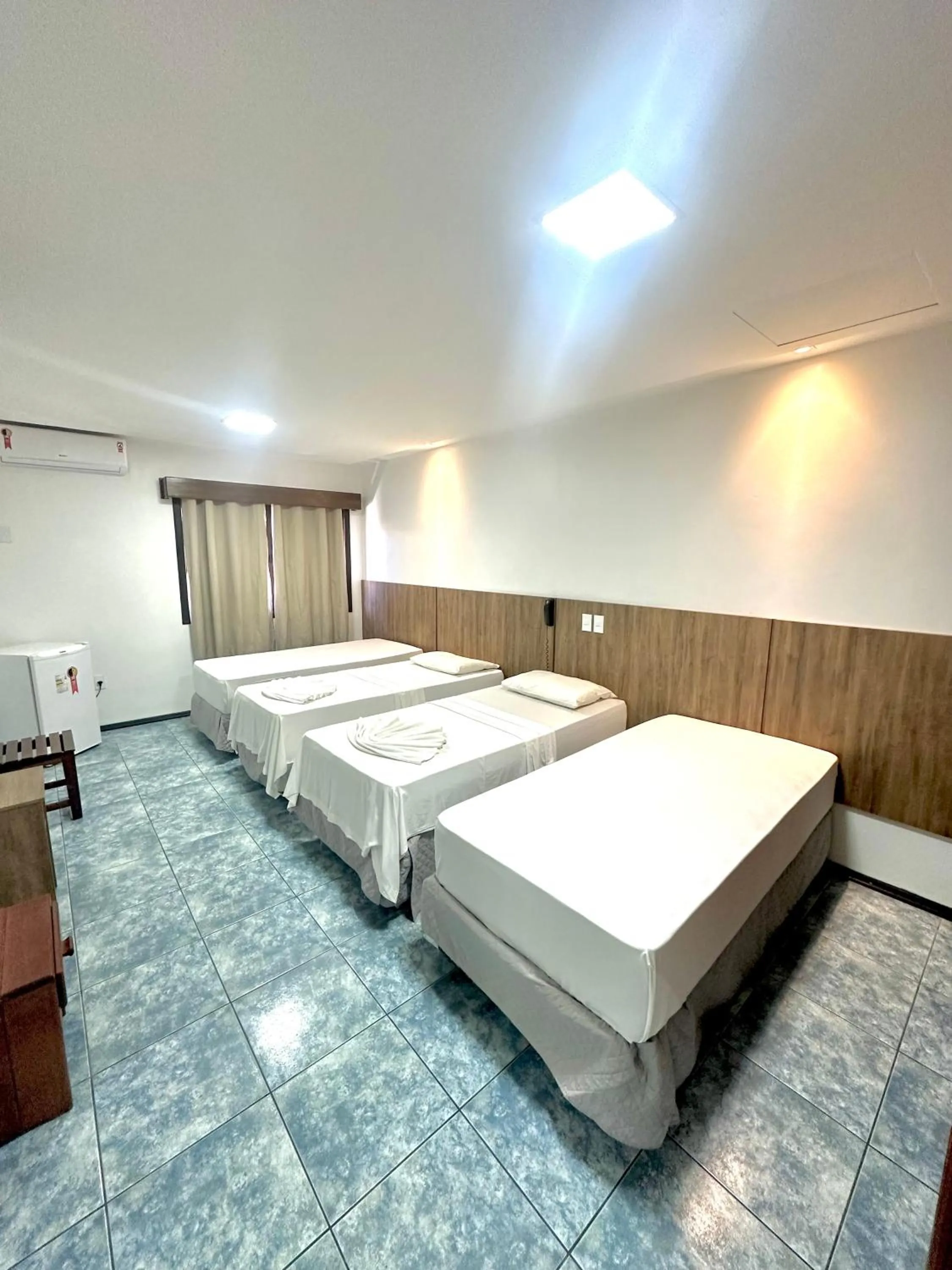 Bed in Hotel Bem Brasil