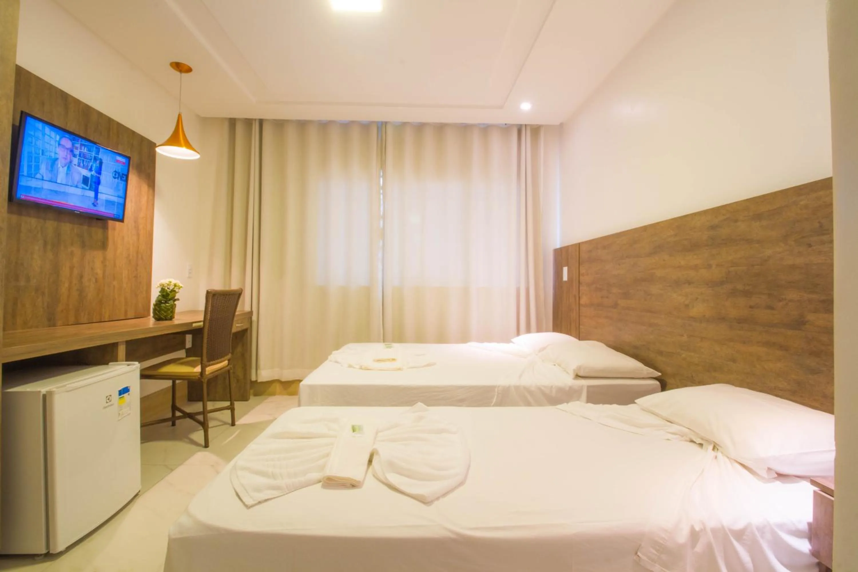 Bed in Hotel Bem Brasil