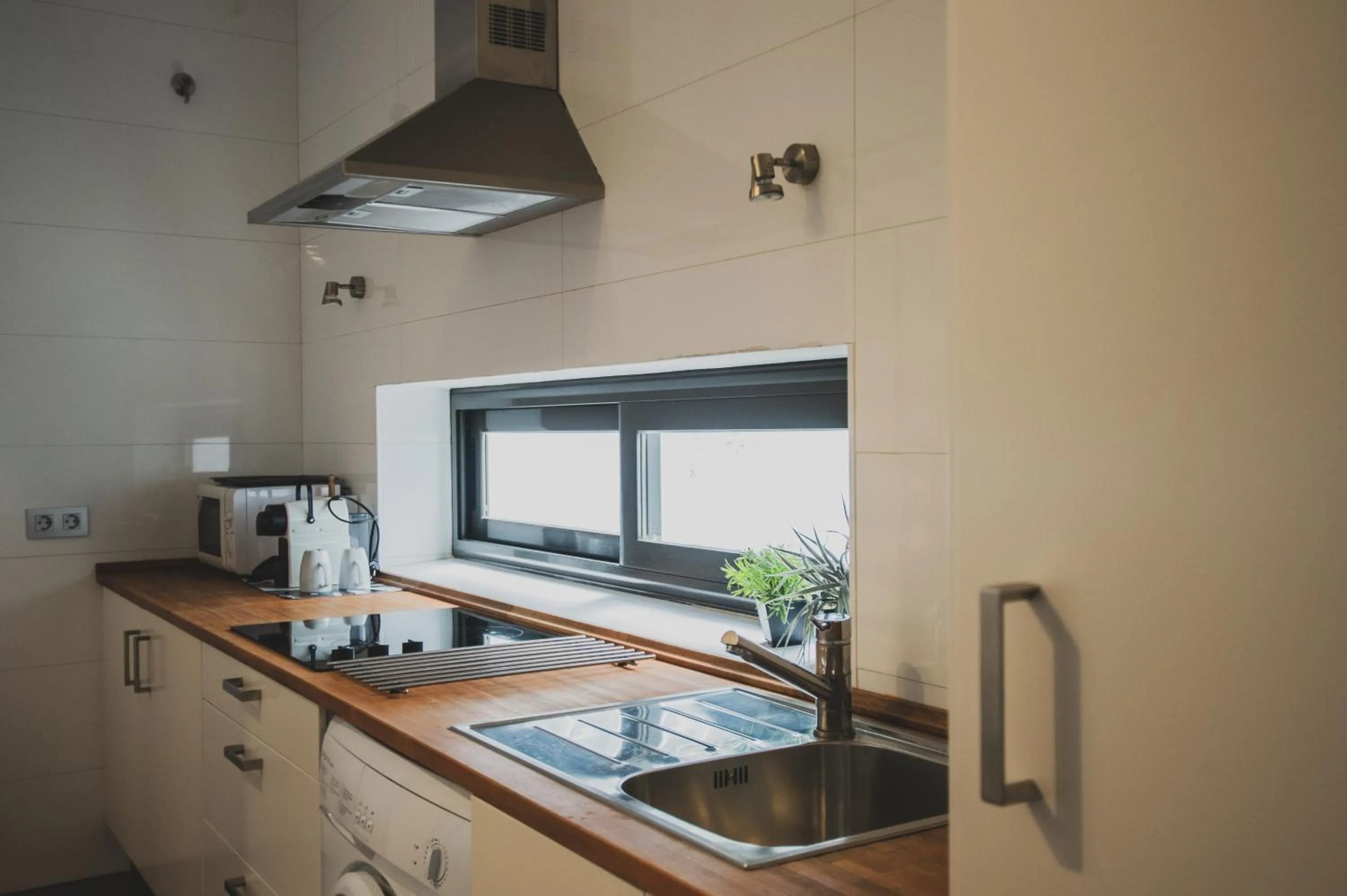 Kitchen or kitchenette in AZZ Sevilla Torre de la Plata Apartamentos