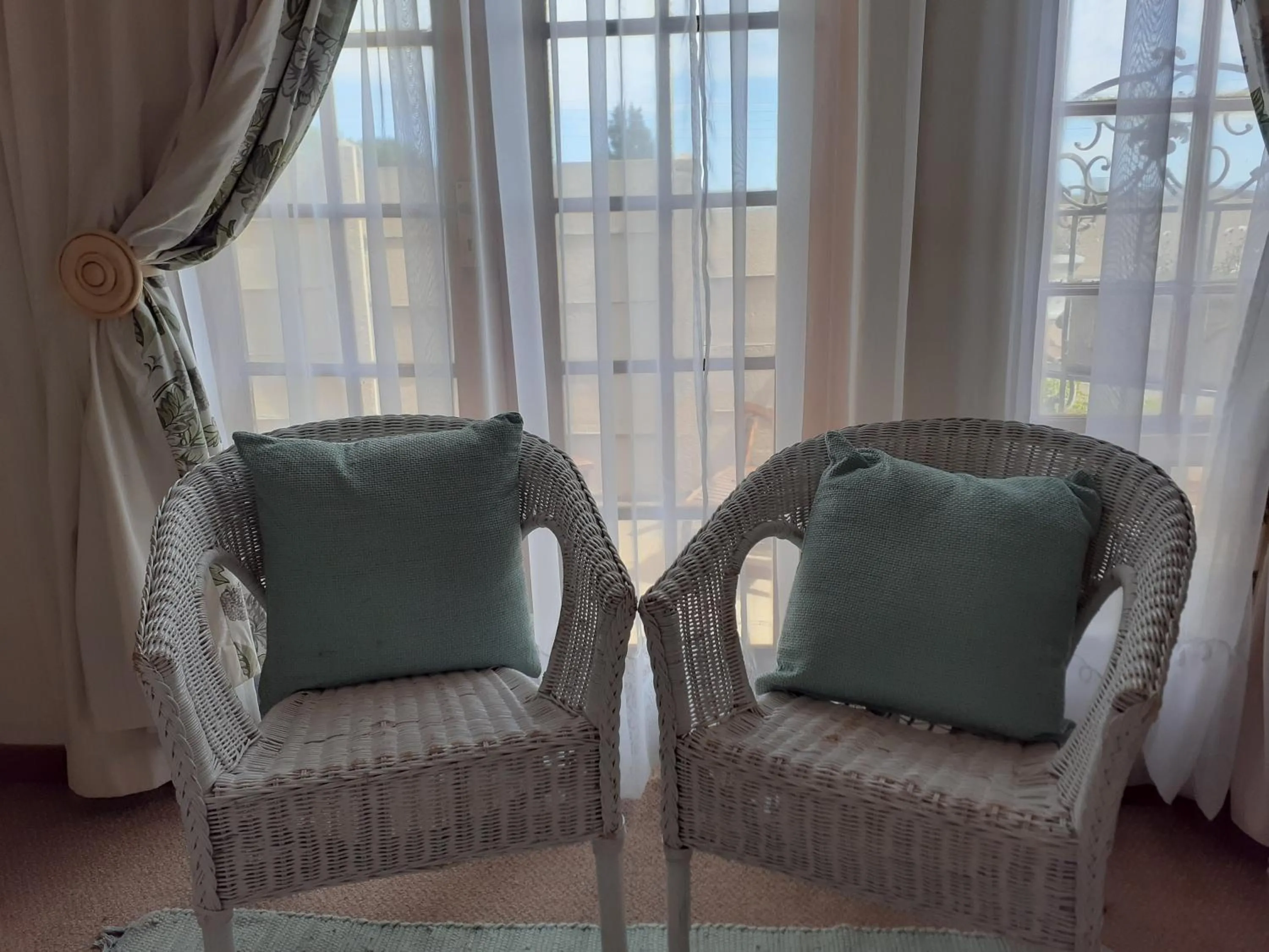 Seating area in Sandstone Chameleon Guest House