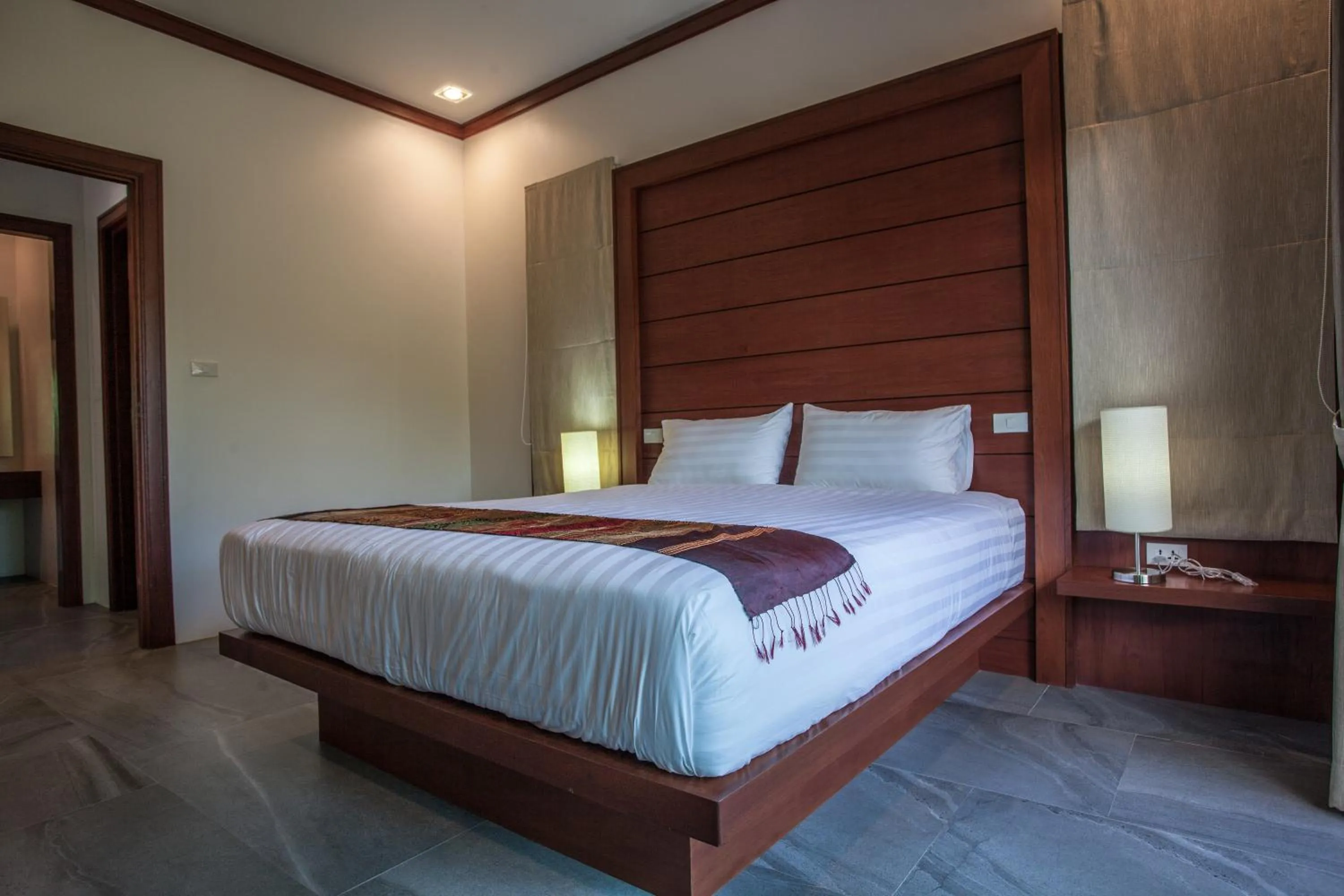 Bed in Baan Pinya Cosy One Bedroom Executive Bungalow