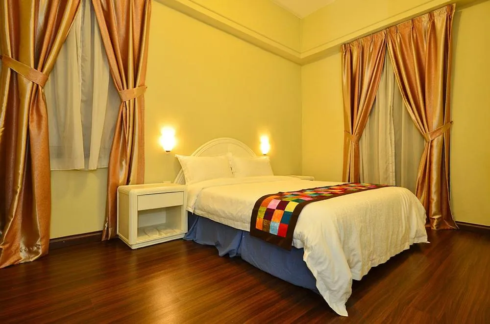 Bed in Jetty Suites Apartments