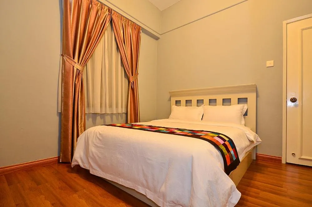 Bed in Jetty Suites Apartments