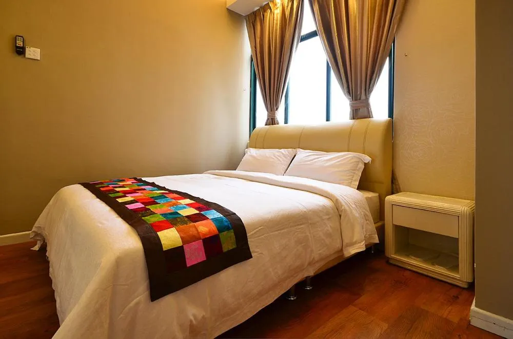 Bed in Jetty Suites Apartments