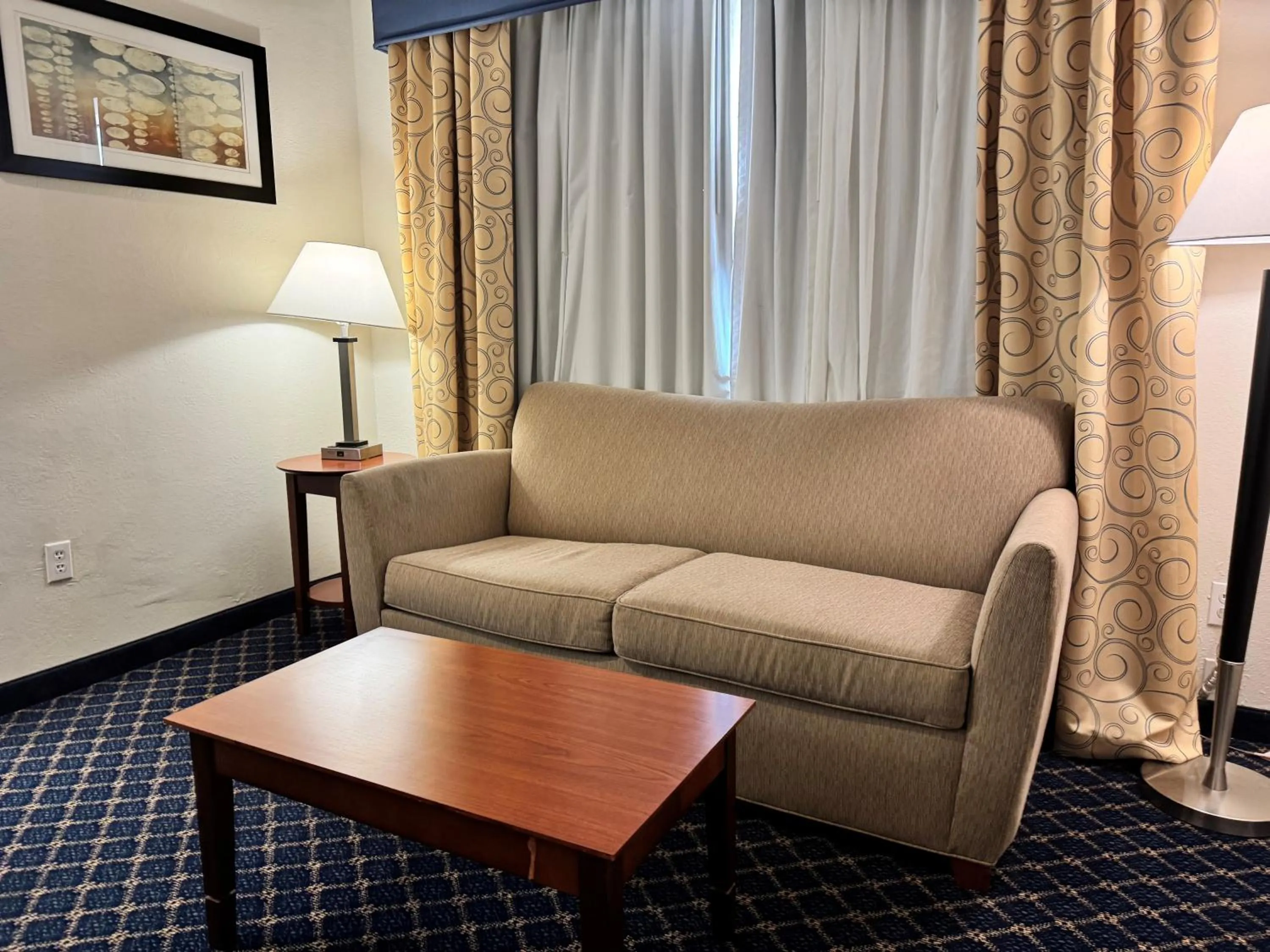 Seating area in Baymont by Wyndham McComb