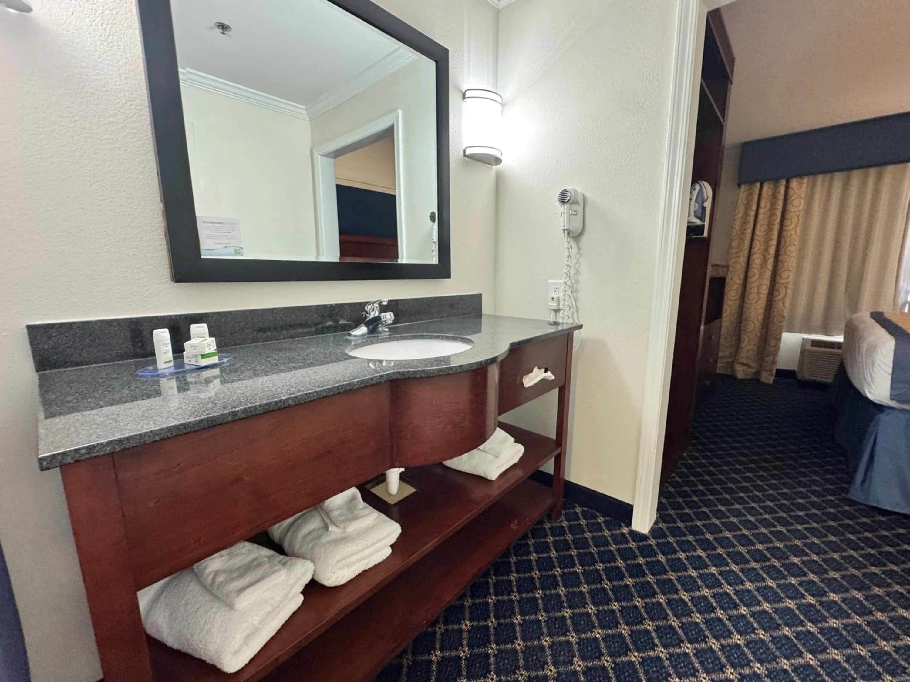 Bathroom, Bed in Baymont by Wyndham McComb