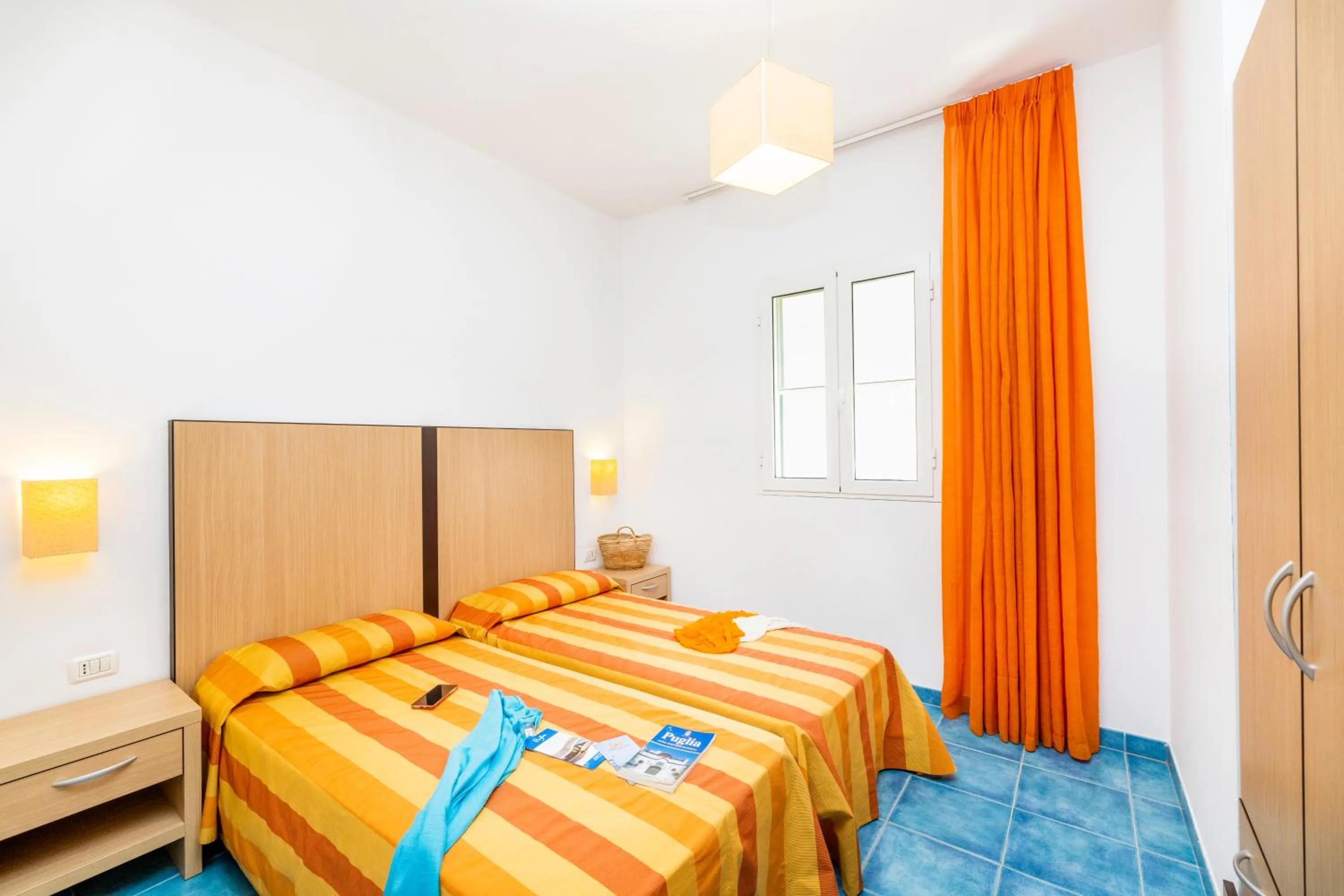 Bed in Baia Degli Aranci Suite & Apartments