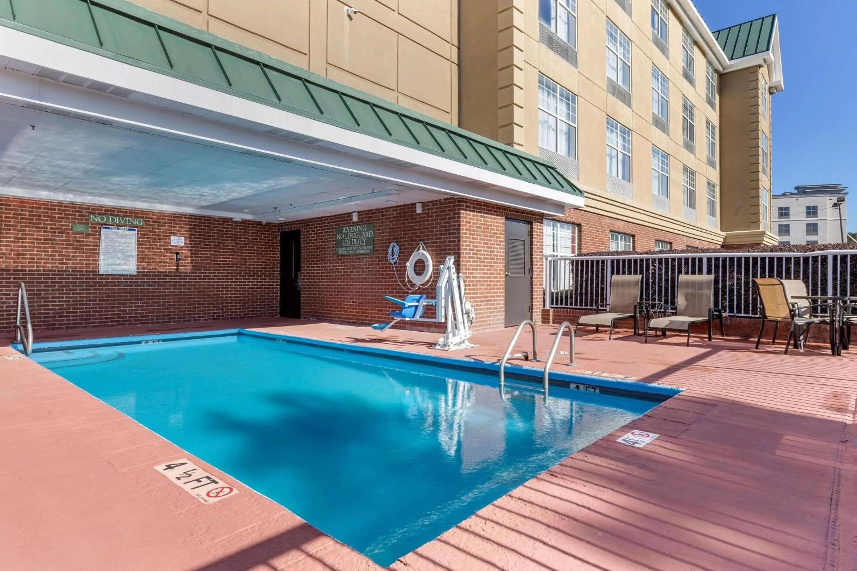 Swimming pool in Country Inn & Suites by Radisson, Lumberton, NC
