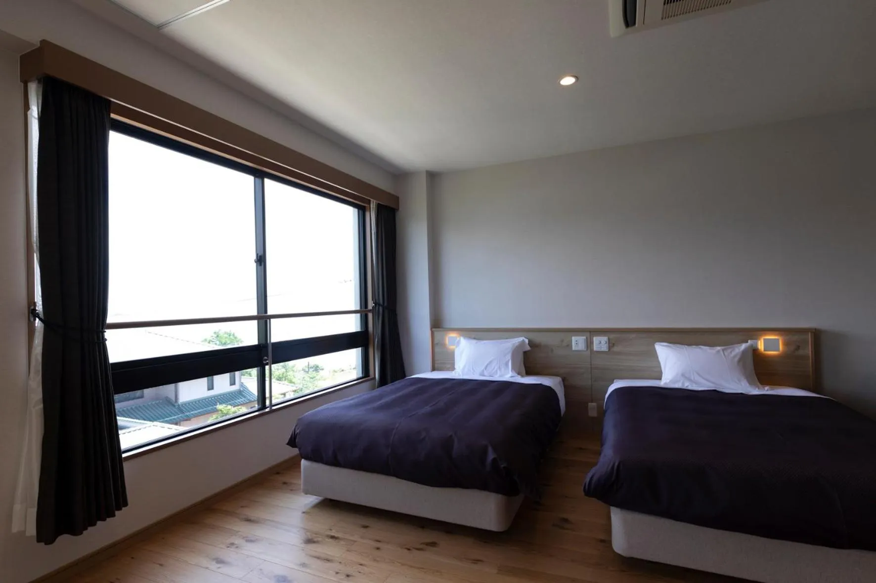 Bed in 宮島離れの宿 IBUKU -Miyajima Hanare no Yado IBUKU-