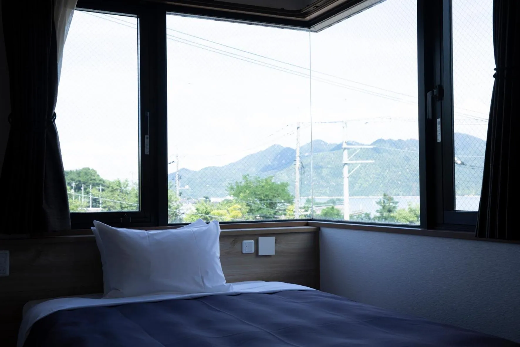 Bed in 宮島離れの宿 IBUKU -Miyajima Hanare no Yado IBUKU-