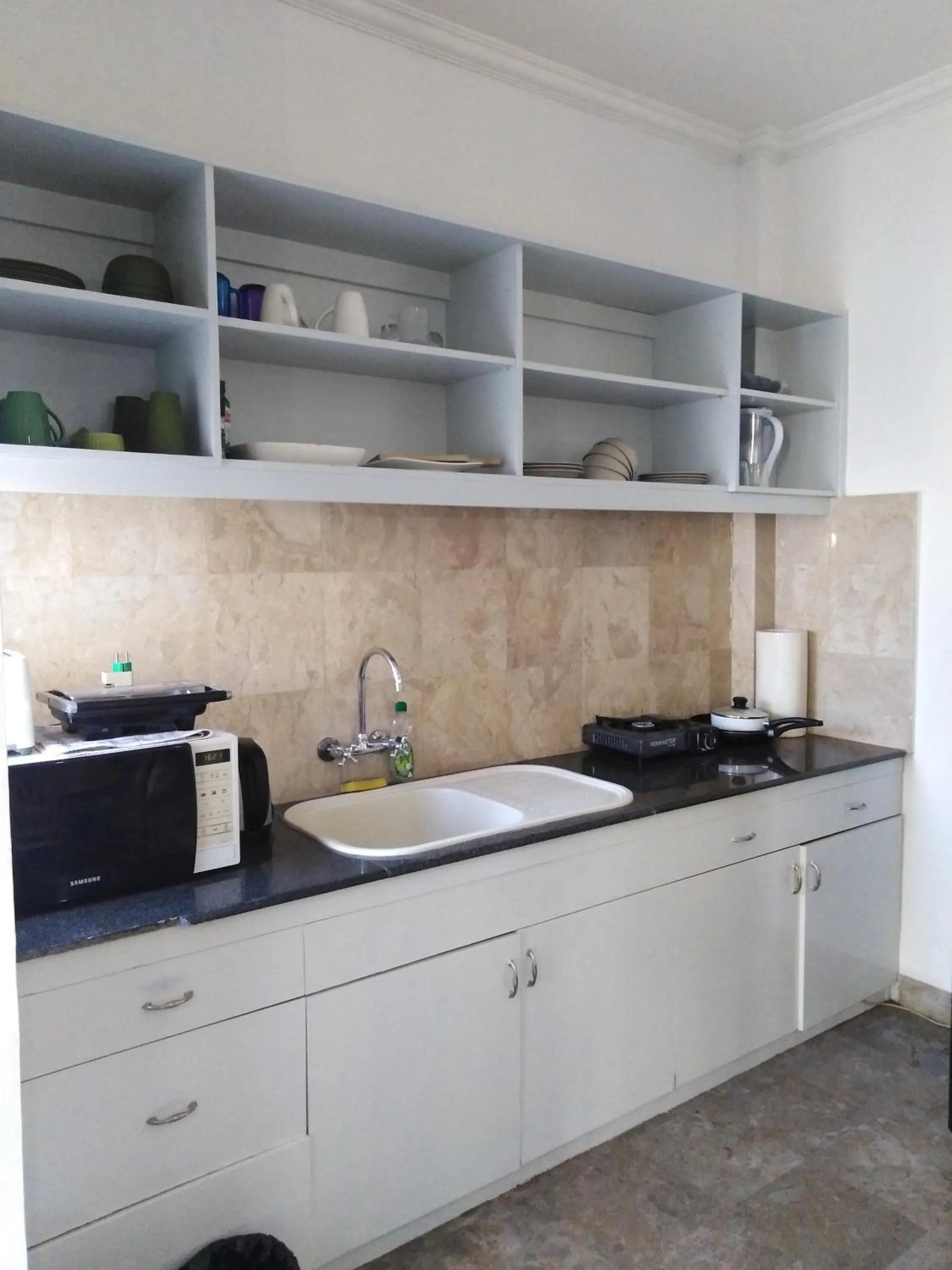 Kitchen or kitchenette in Bali Court Hotel & Apartment