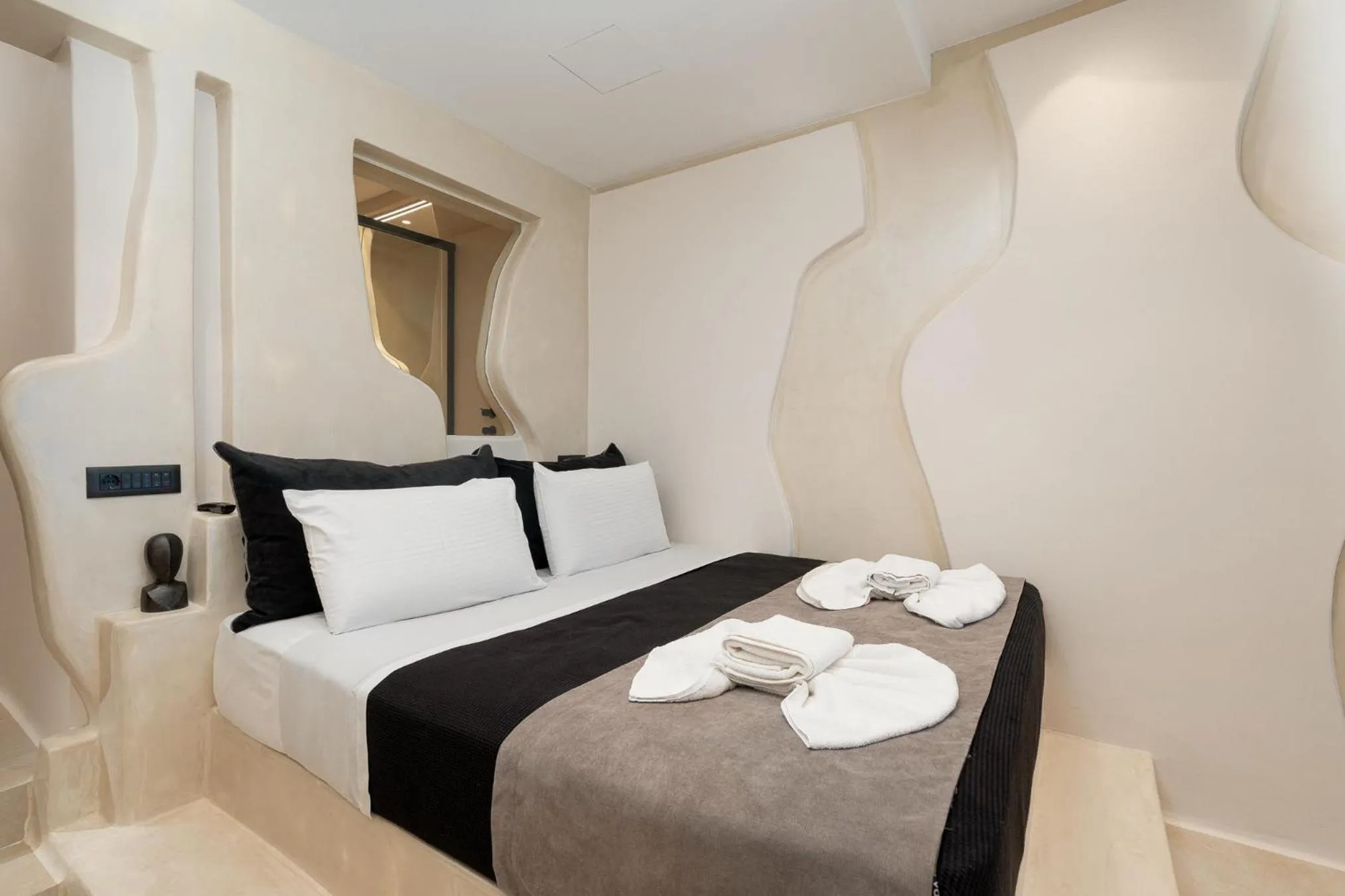 Bed in Portara Seaside Luxury Suites