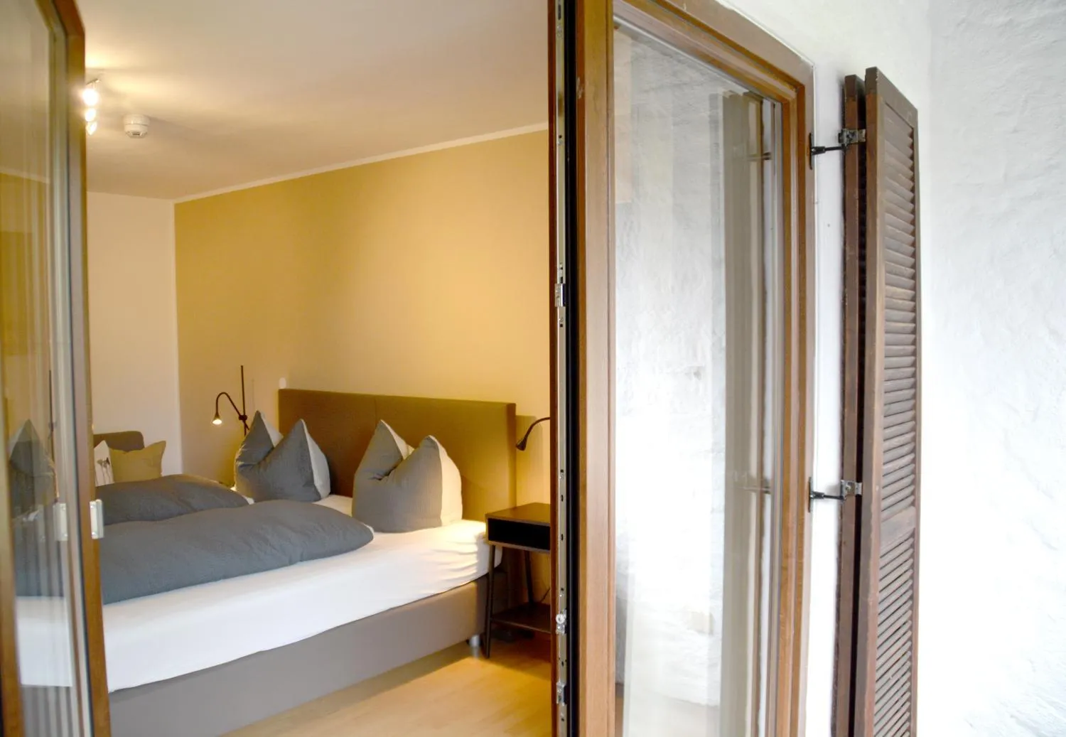 Bed in Pension Almhof Baumgarten