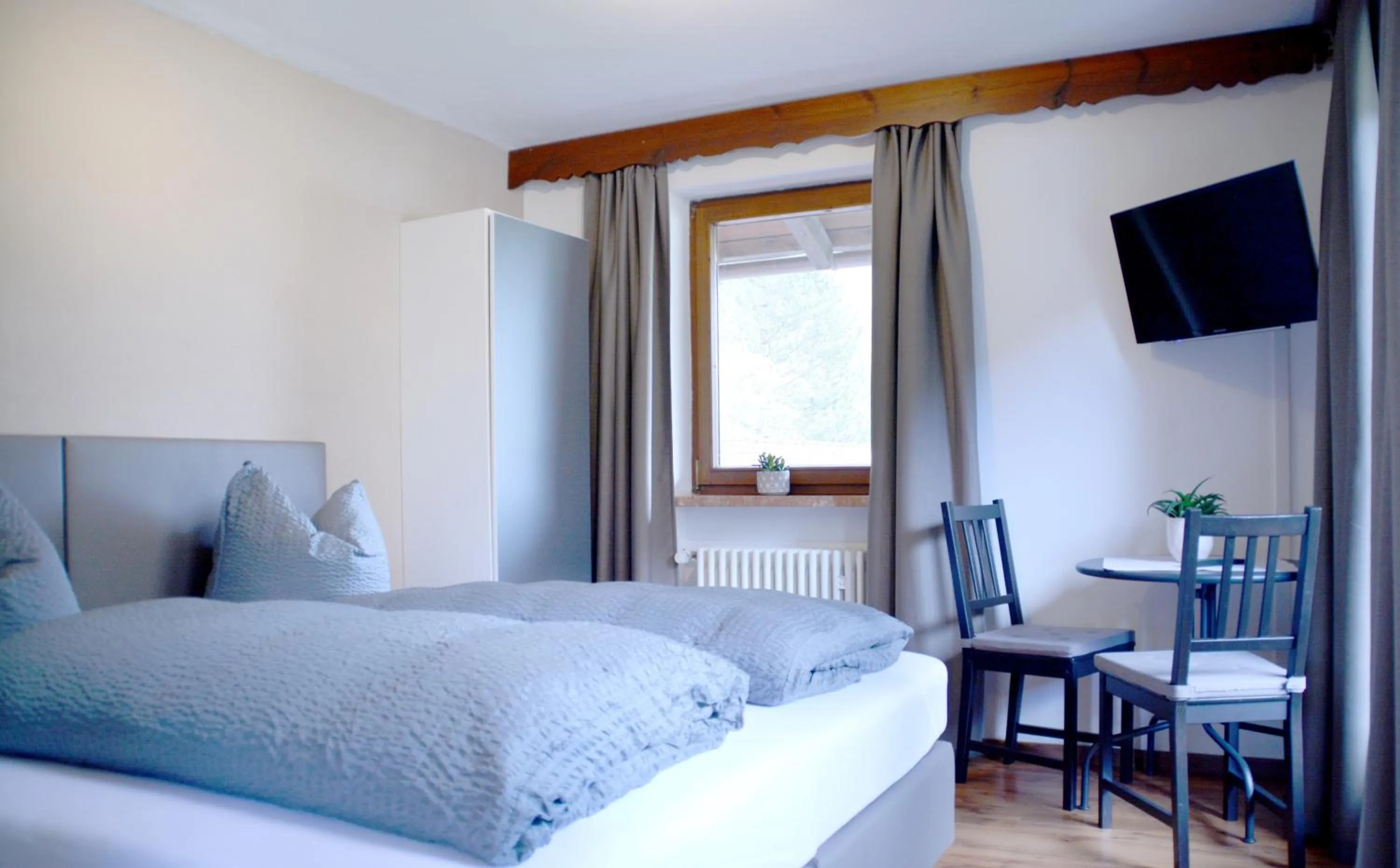 Bed in Pension Almhof Baumgarten