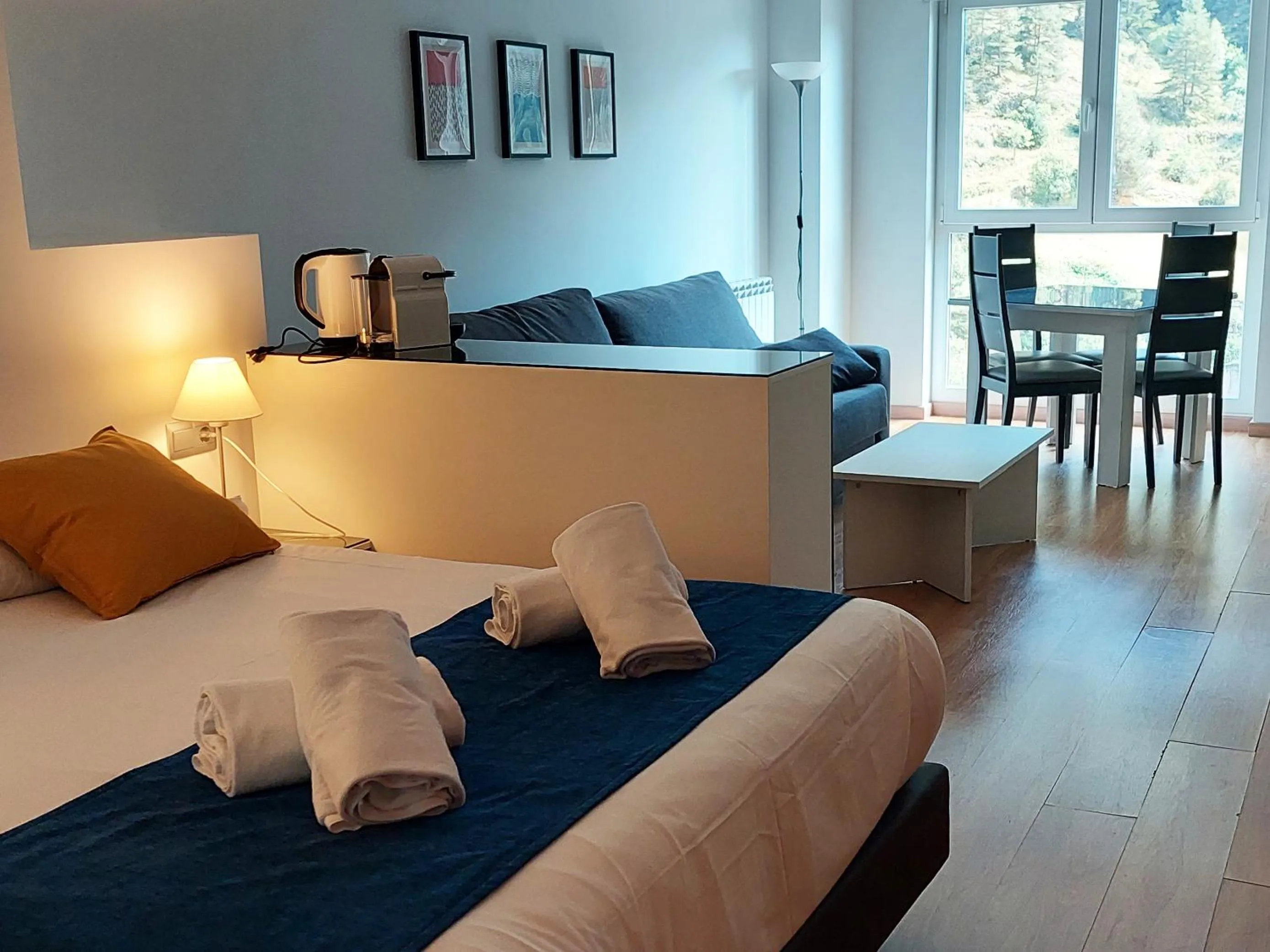 Living room, Bed in The Lodge at Ribasol