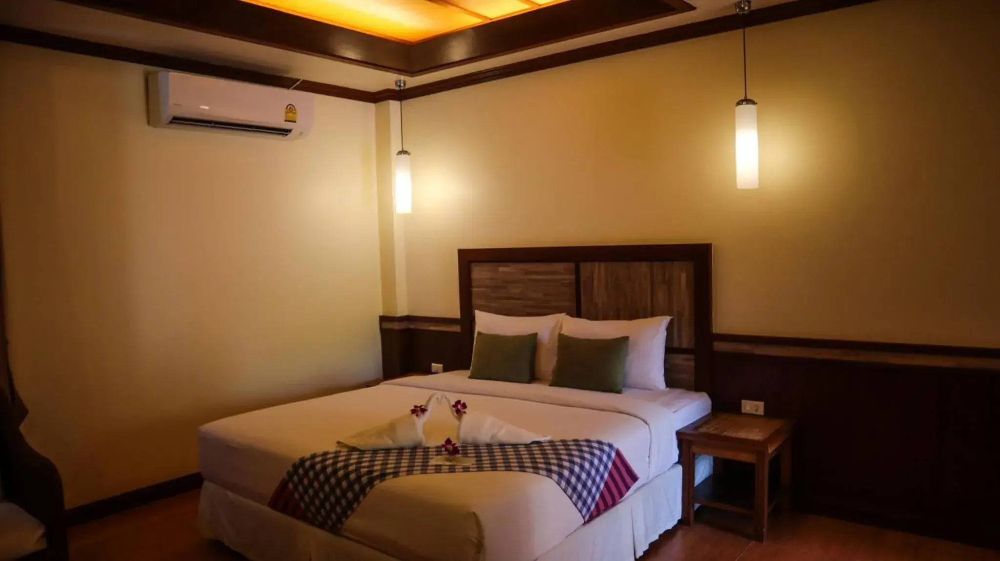 Bed in Mac Resort Hotel Bed in Mac Resort Hotel