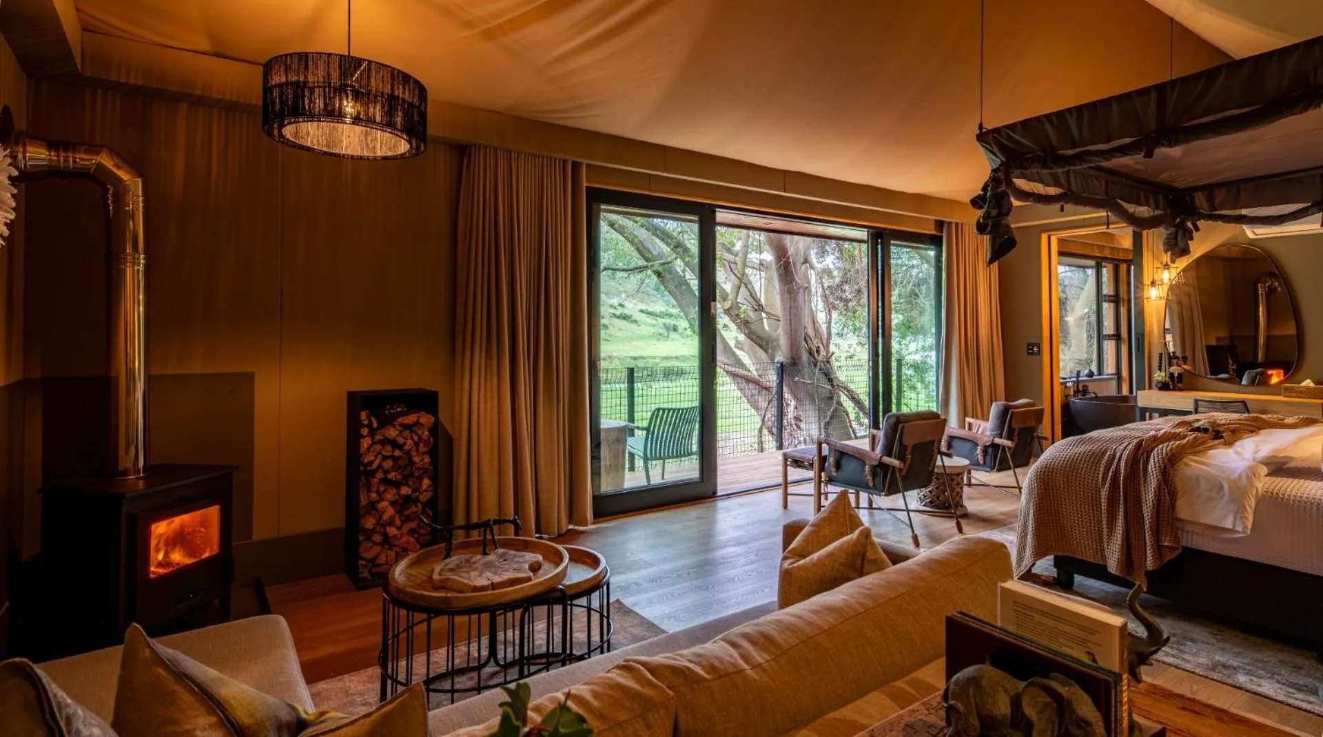 Seating area, Bed in Botlierskop Tented Lodge