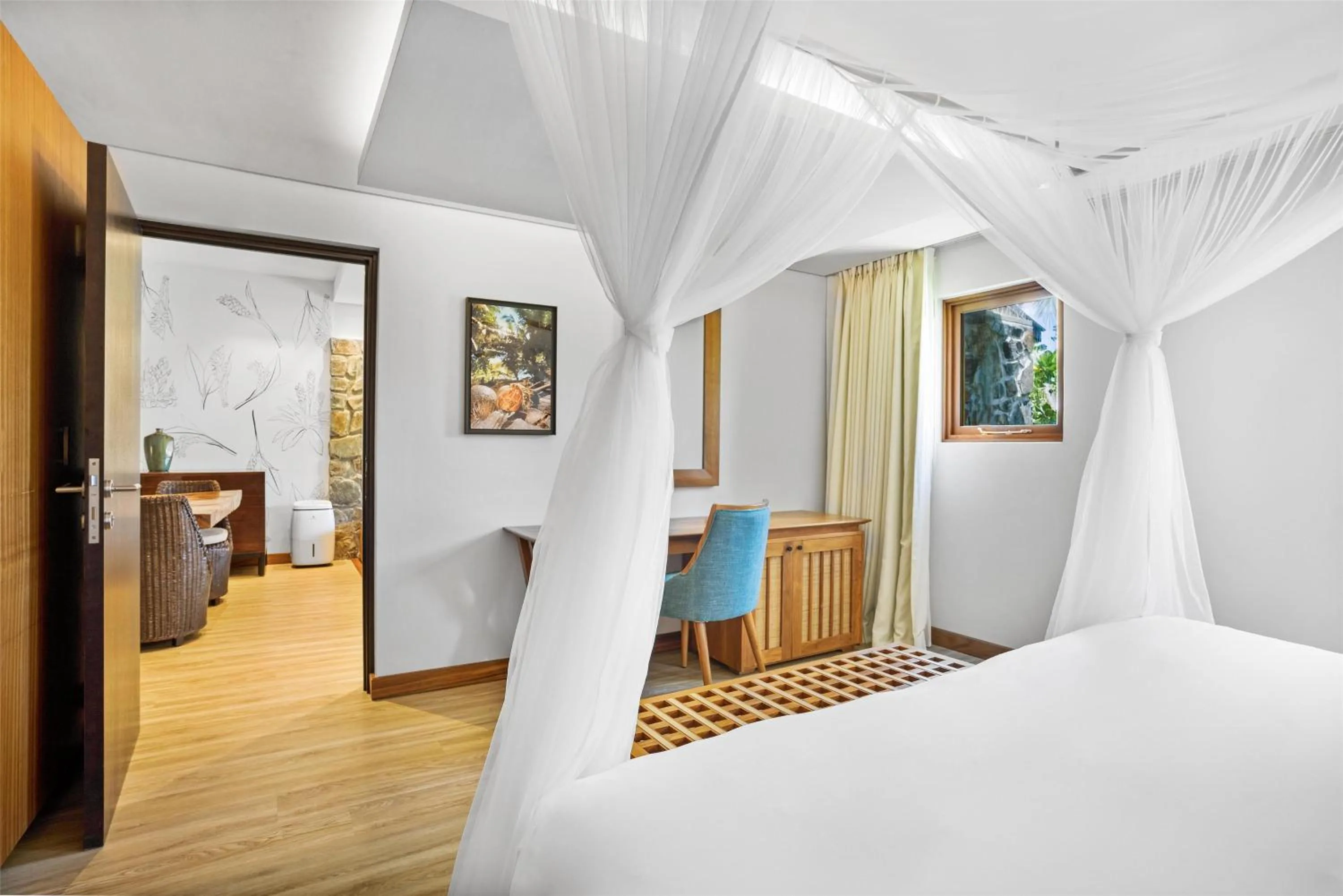 Photo of the whole room, Bed in Kempinski Seychelles Resort