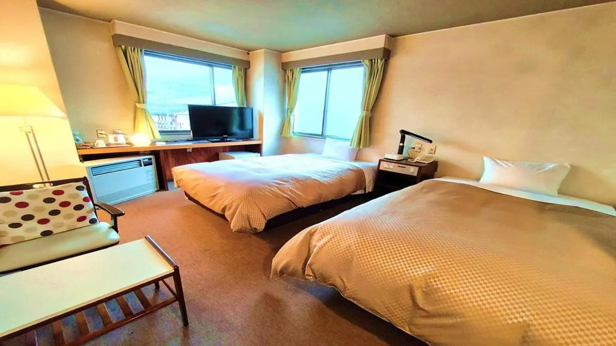 Bed in Hotel Sakuranbo