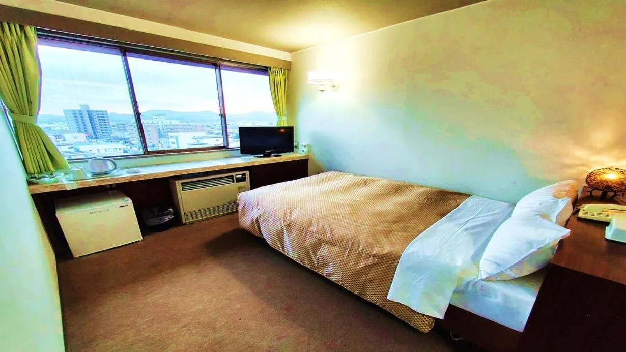 Bed in Hotel Sakuranbo