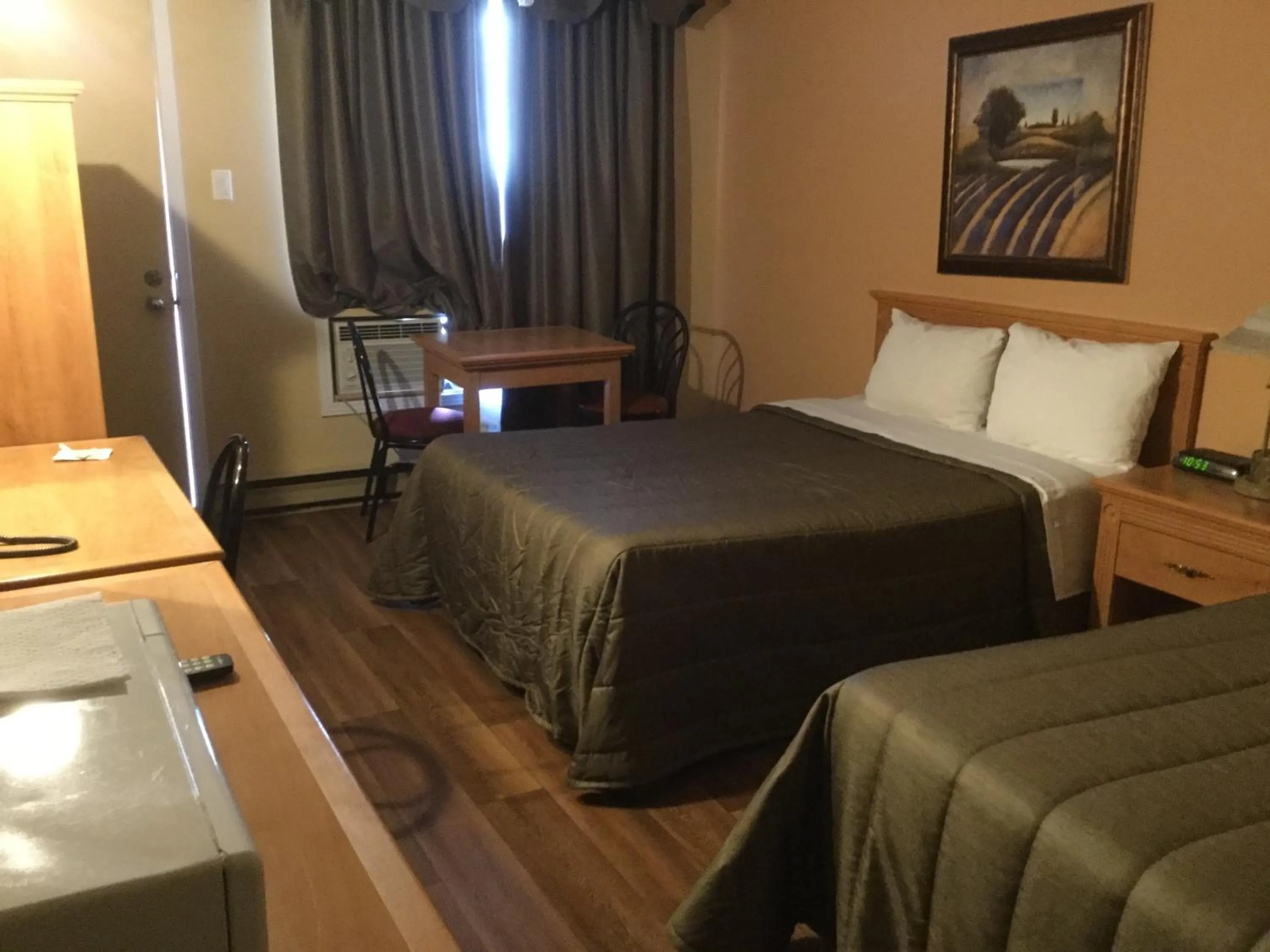 Bed in Hotel Motel Hospitalité